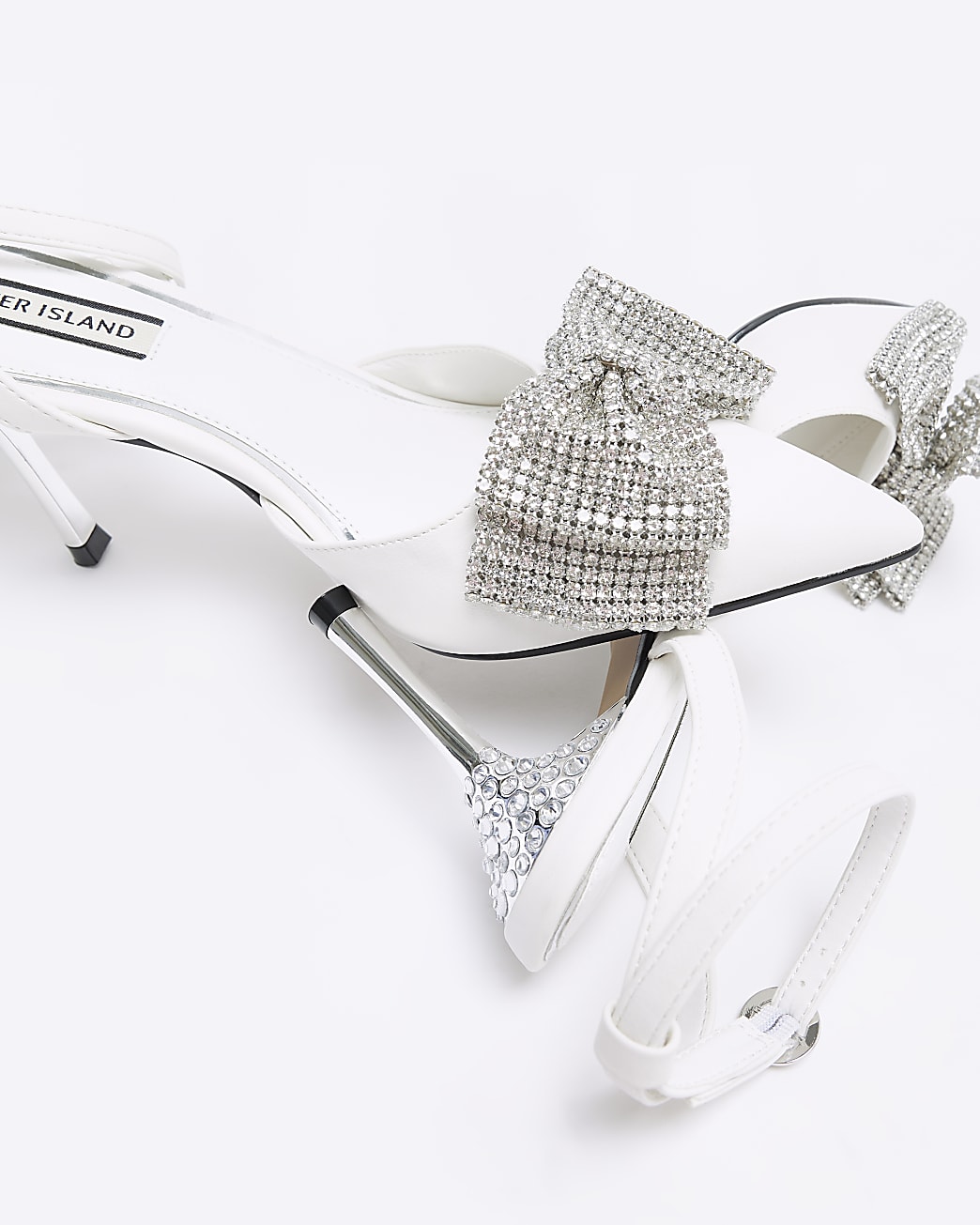 White bow heeled court shoes
