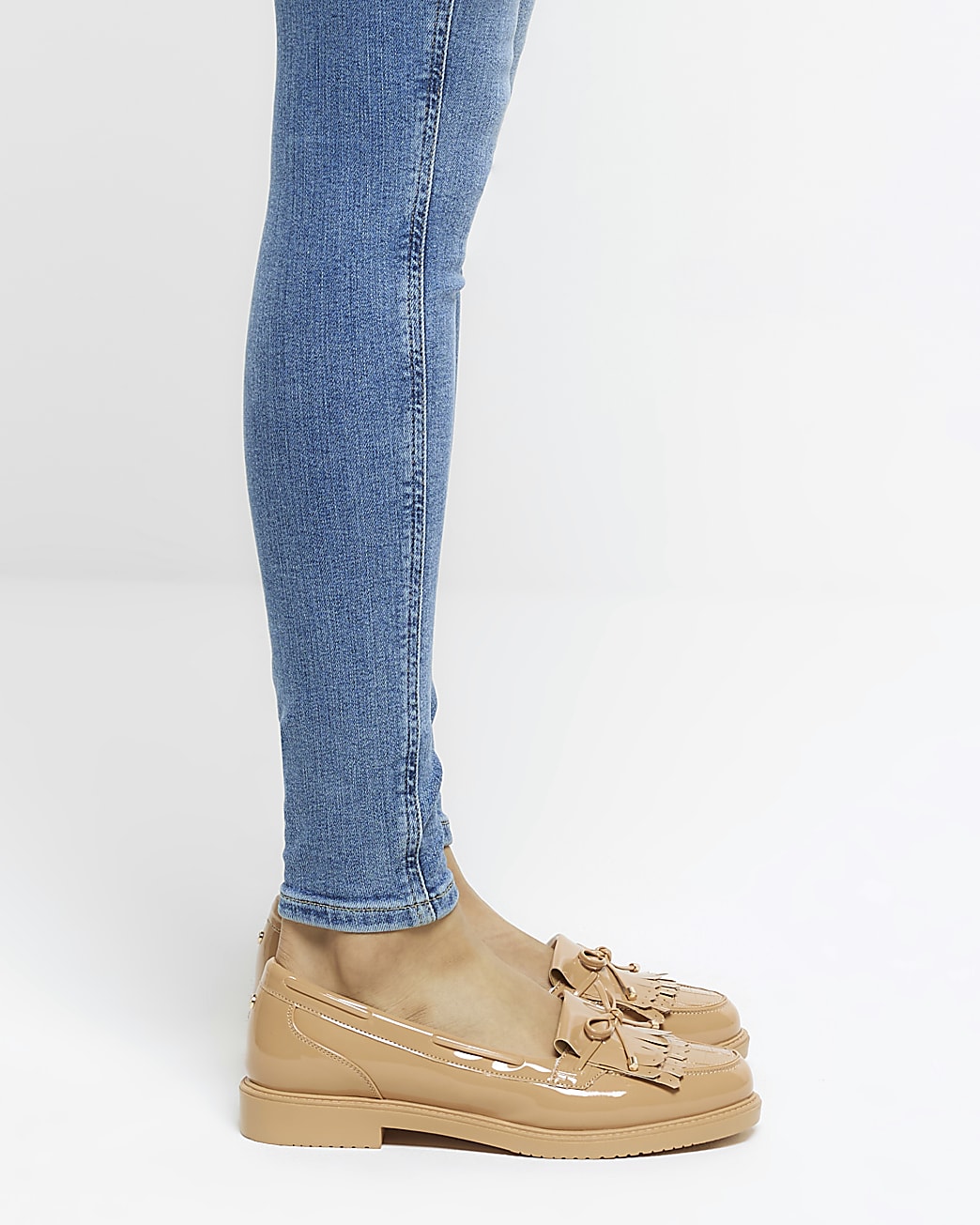 Beige patent tassel trim loafers