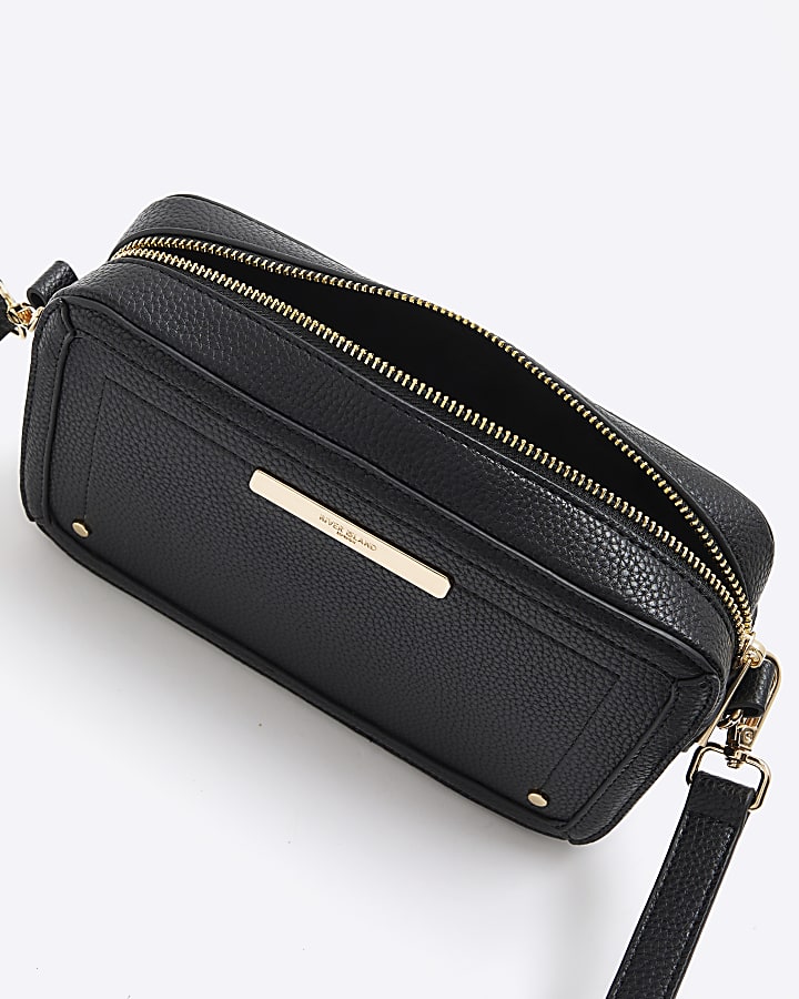 Black faux leather pom pom cross body bag