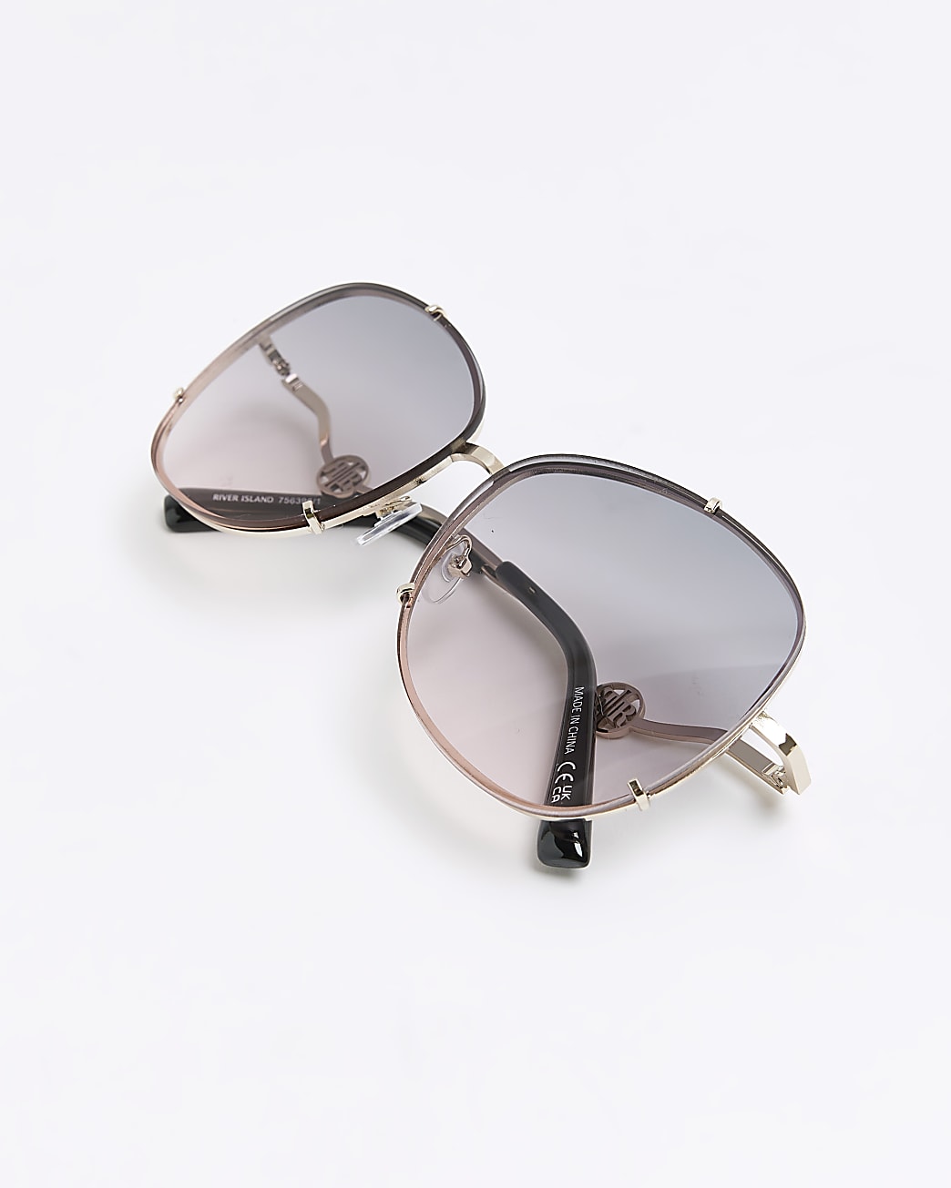 Gold rimless oversized round sunglasses