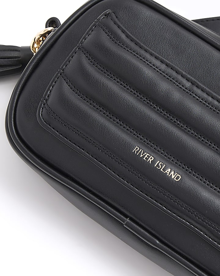 Black quilted flap front cross body bag