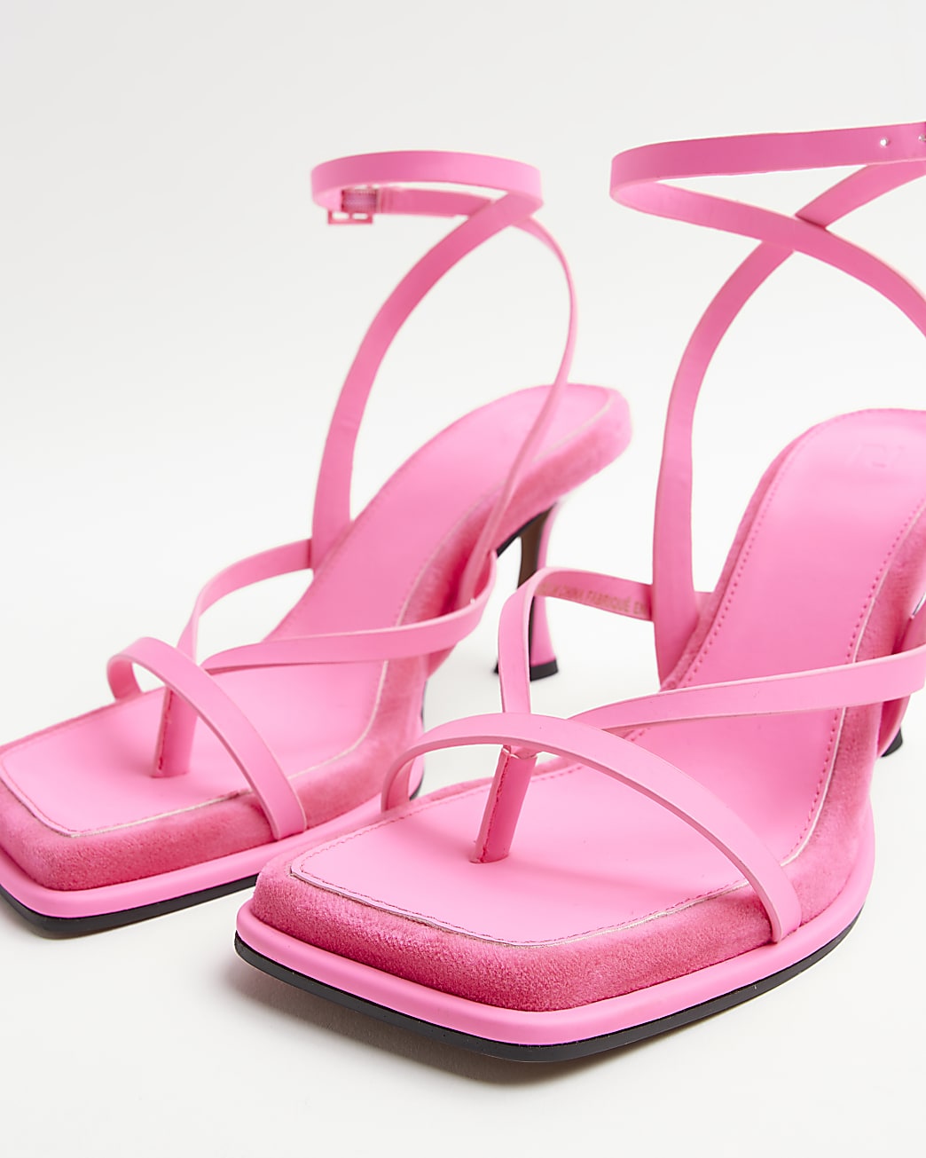 Pink strappy heeled sandals