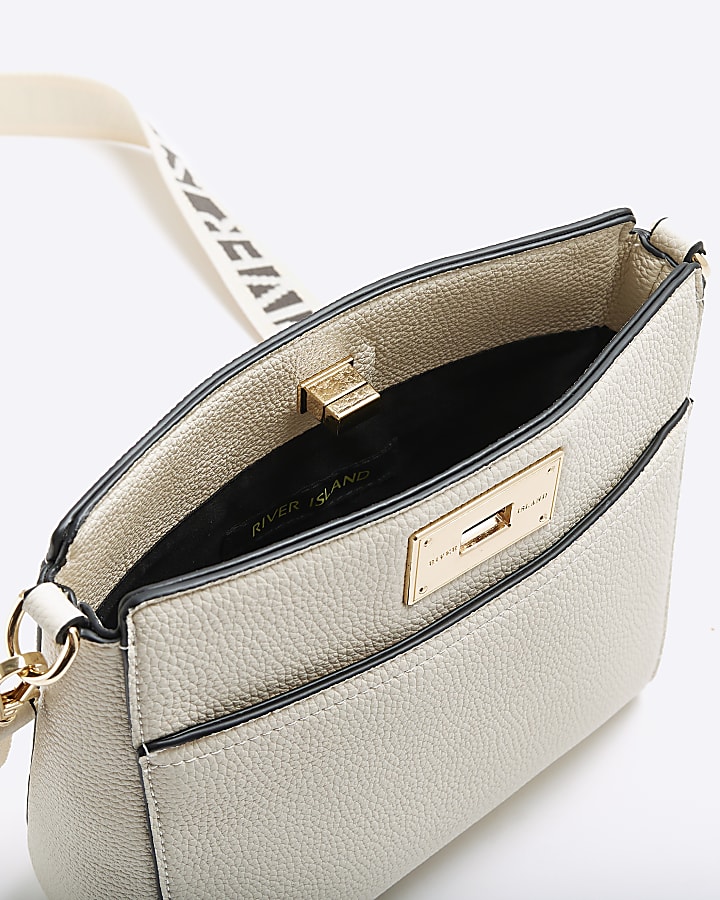 Cream lock messenger cross body bag