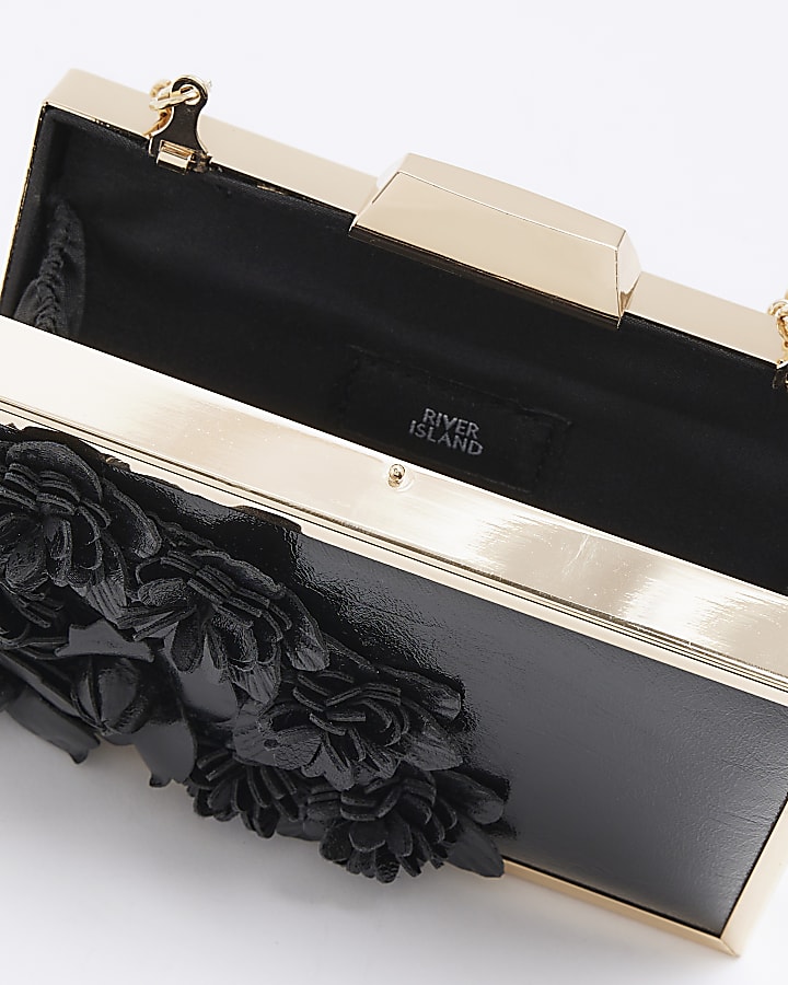 Black flower detail clutch bag