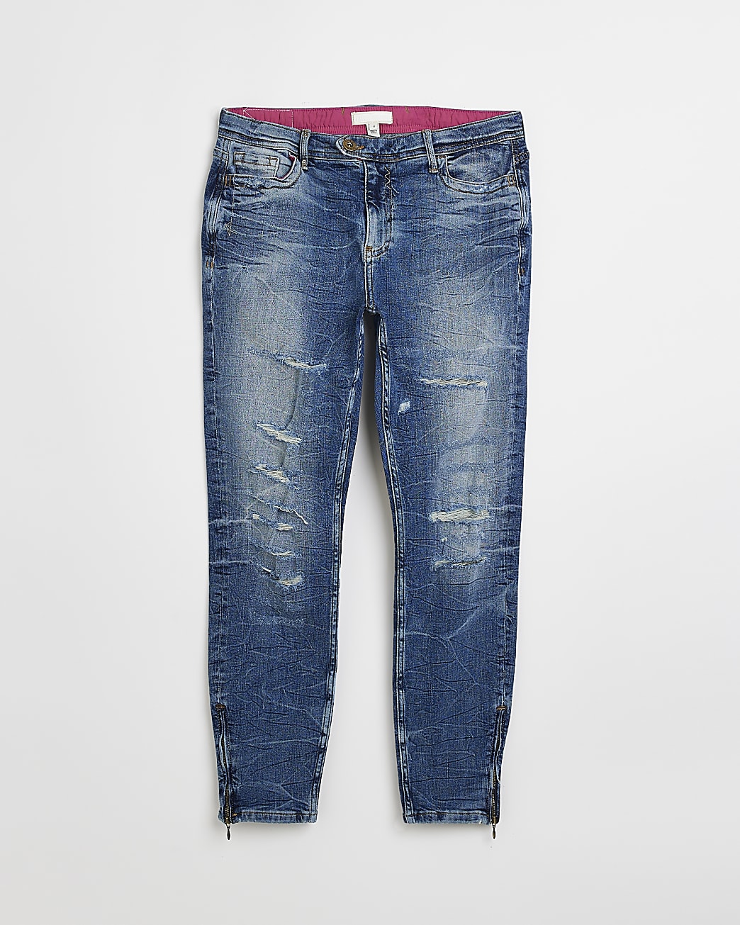 Blue ripped low rise skinny jeans