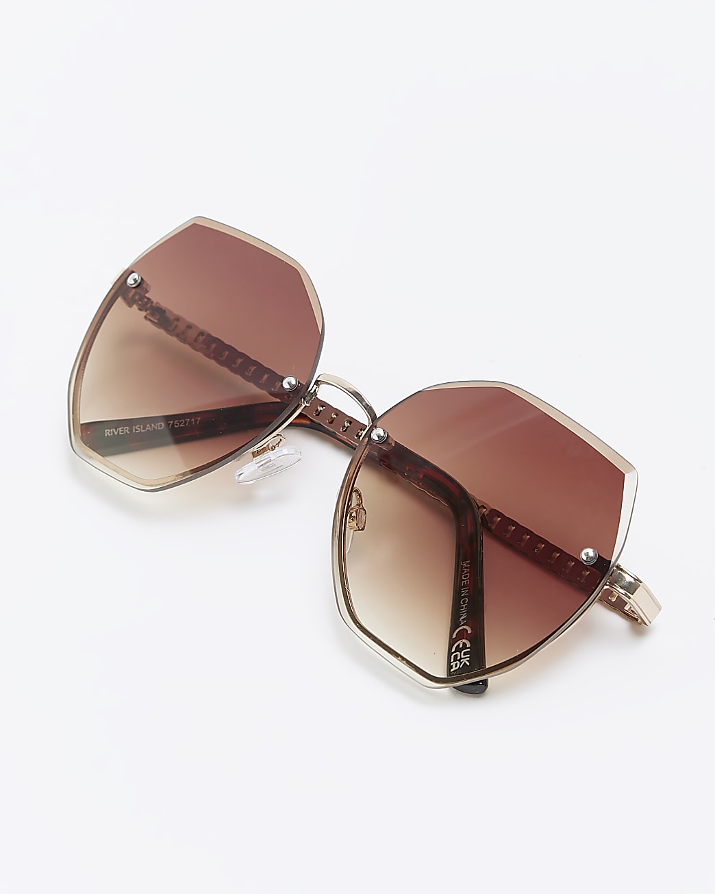 Gold rimless oversized sunglasses