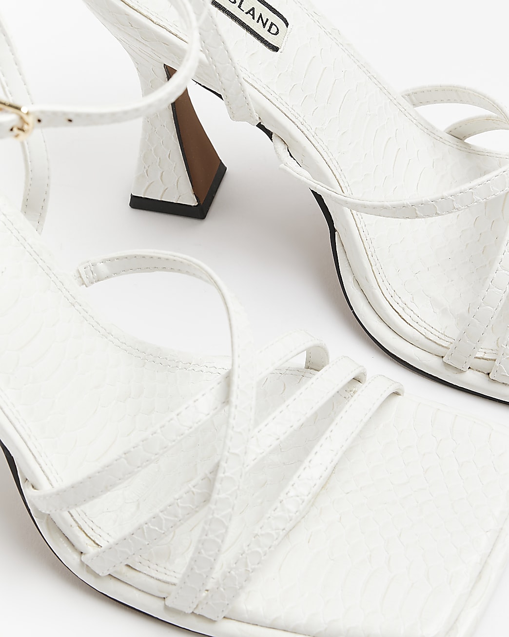 White strappy heeled sandals