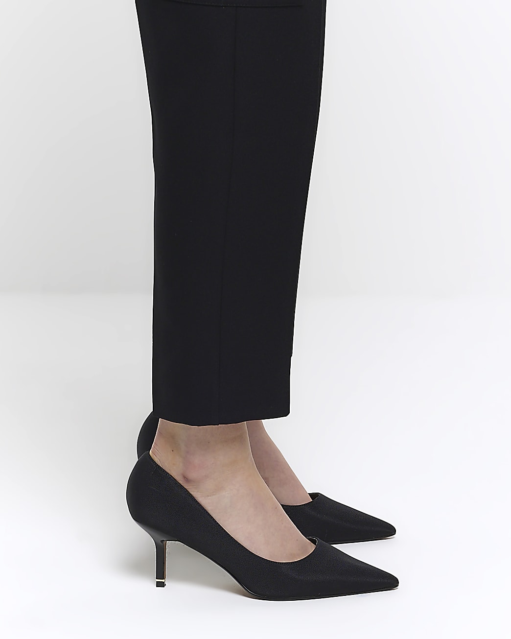 Black pointed toe heeled court shoes