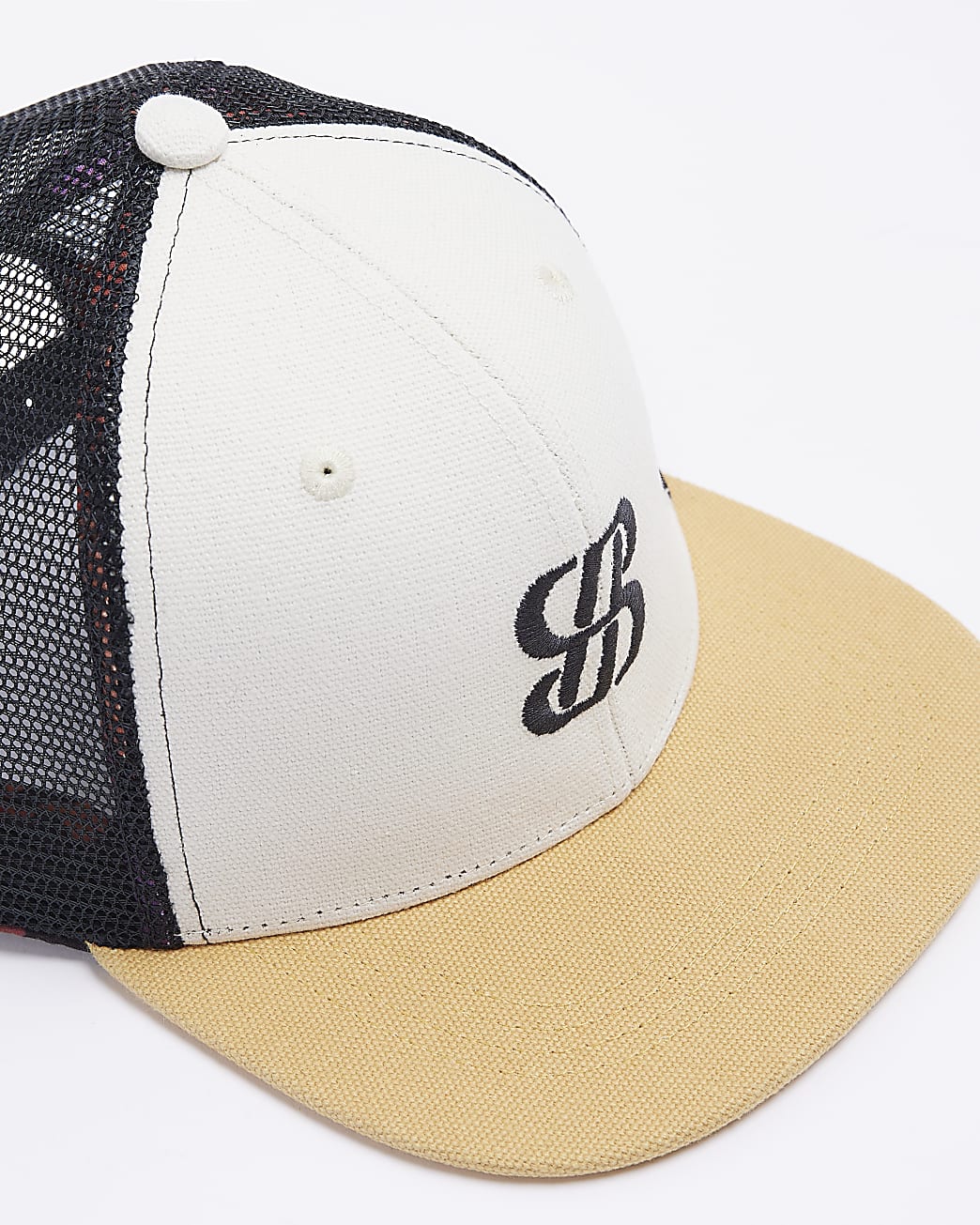 Stone embroidered mesh trucker cap