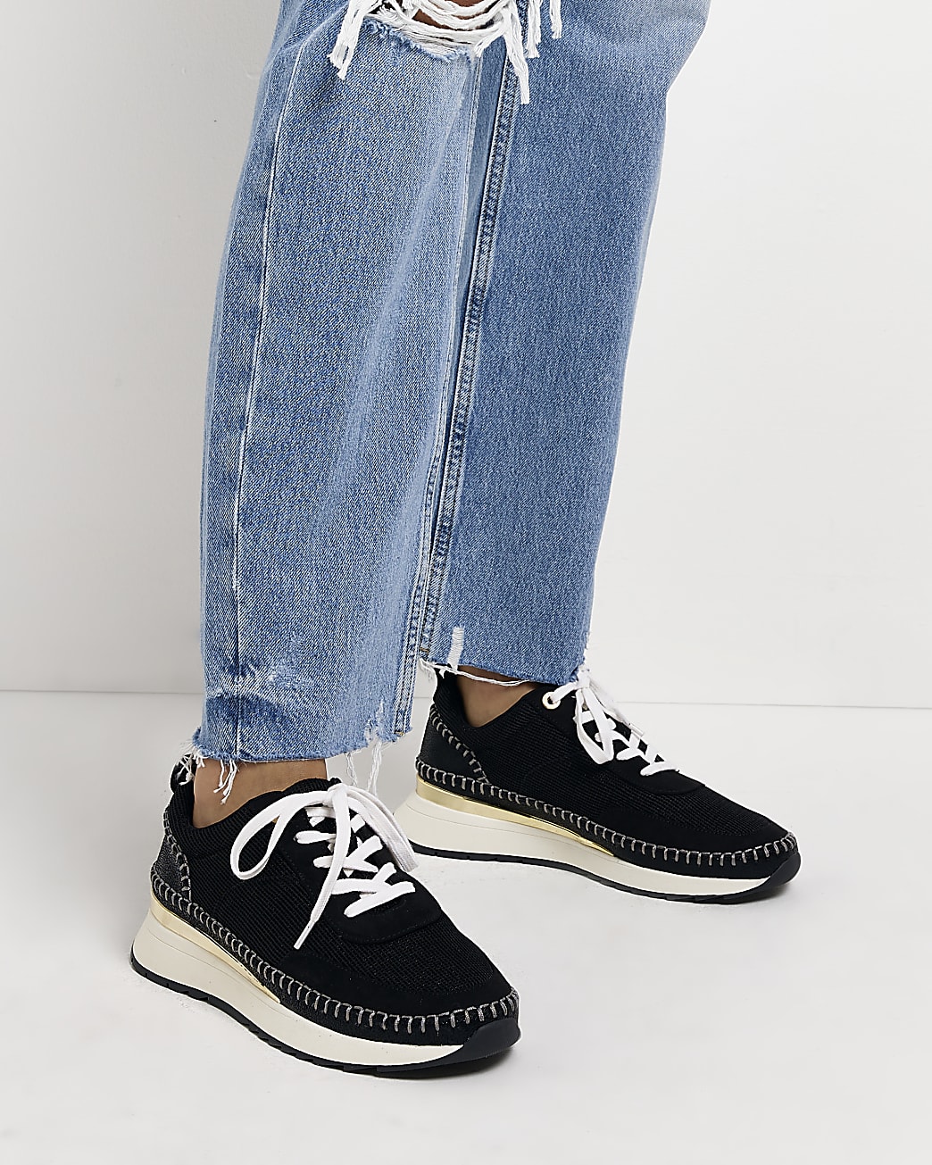 Black stitch detail trainers