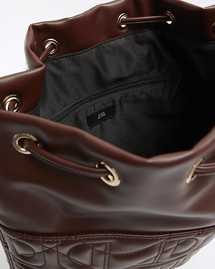 Brown embossed drawstring shoulder bag