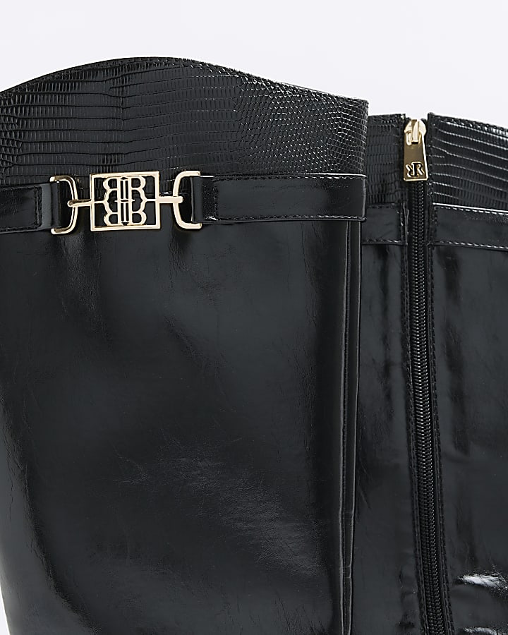 Black buckle knee high boots