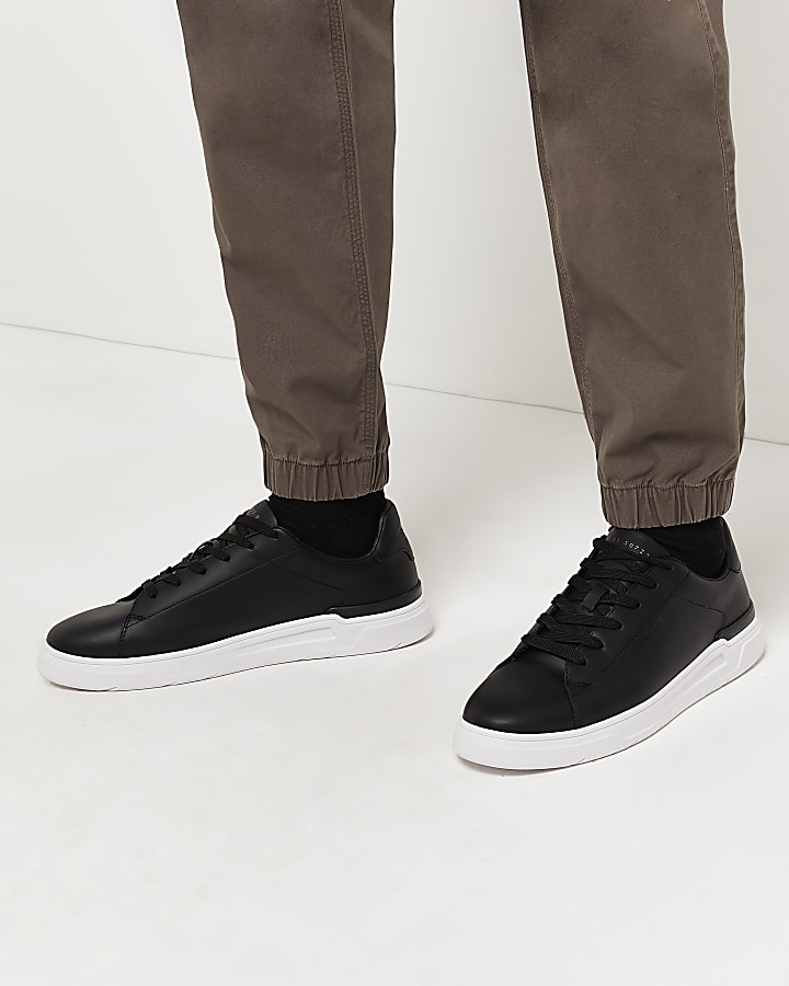 Black lace up cupsole trainers