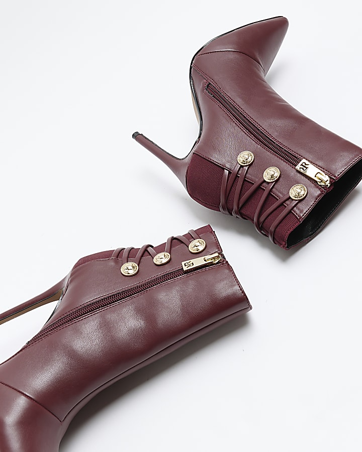 Red tie up heeled boots