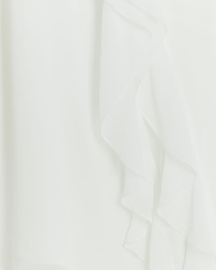 White frill sleeveless blouse