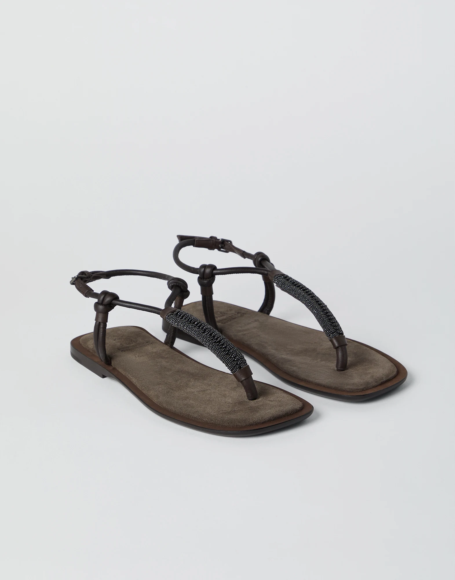 Suede sandals with precious braided straps
