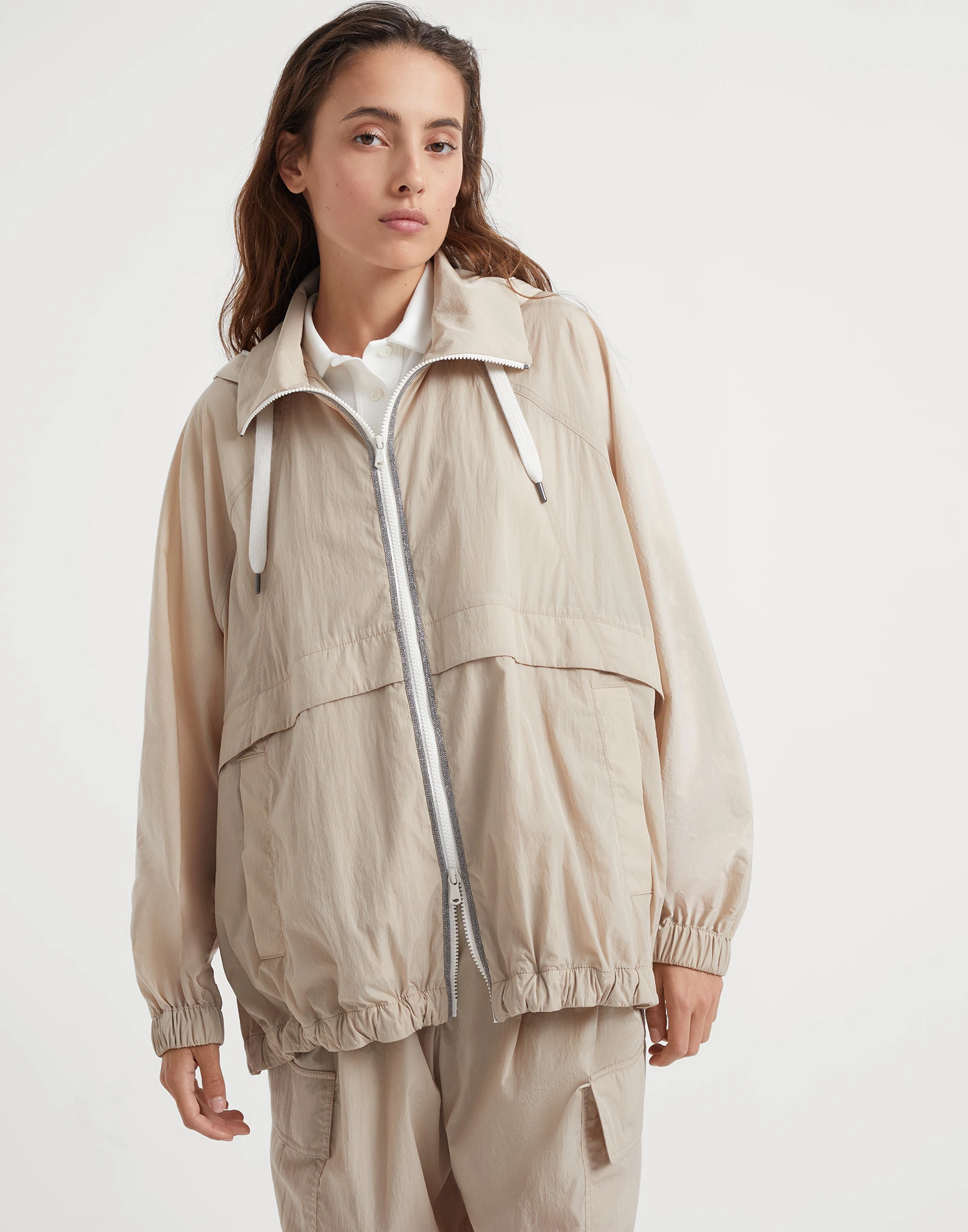 Wrinkled cloth hooded outerwear with precious trims