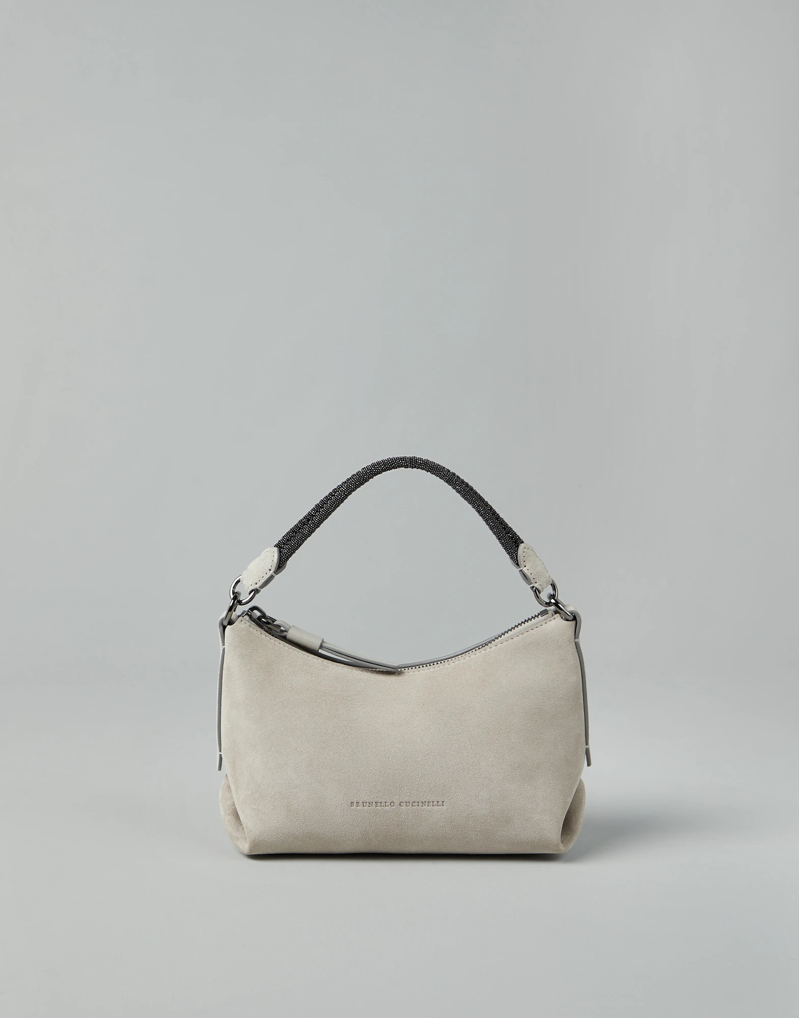 Suede bag with precious braided handle
