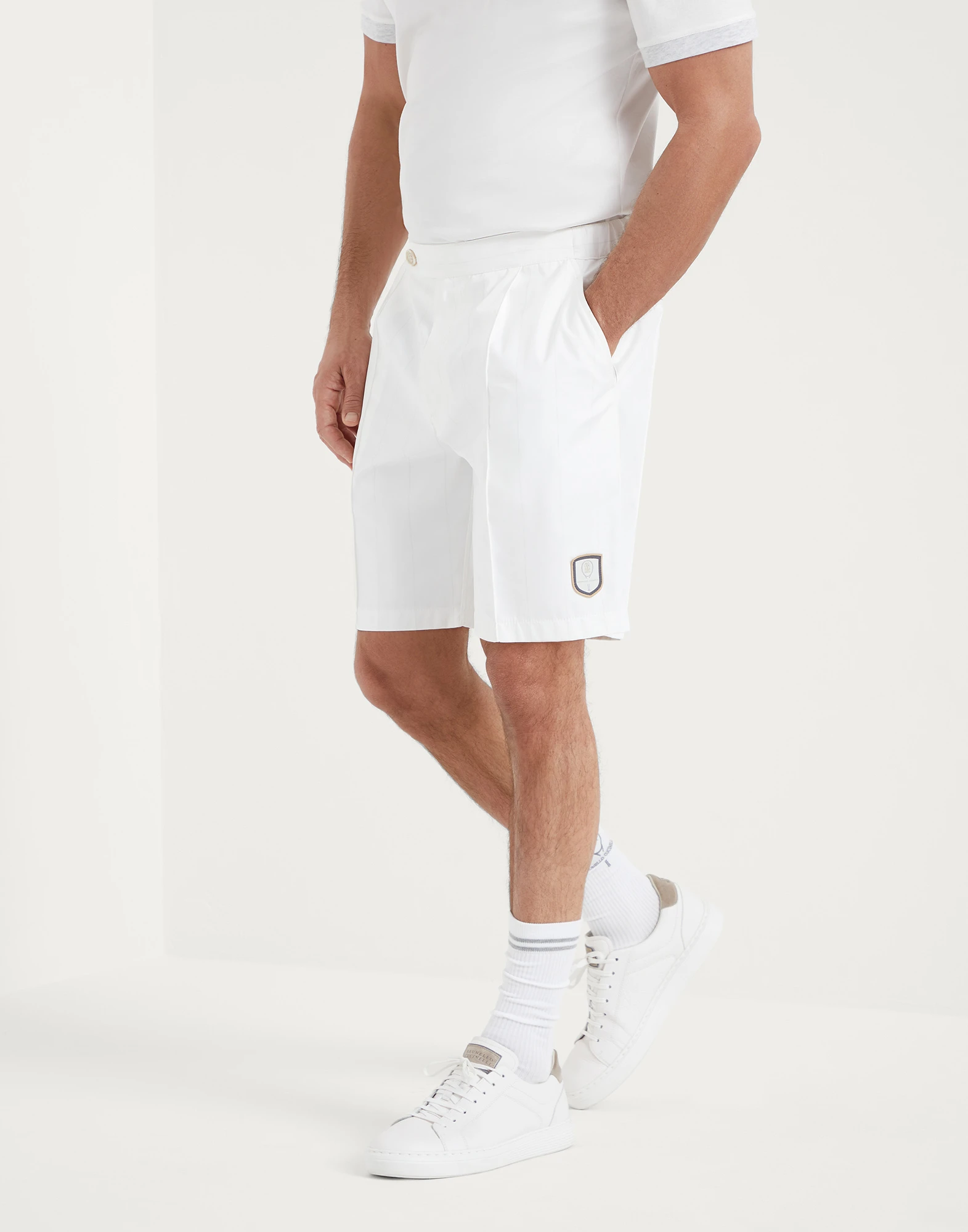 Chalk stripe nylon pleated Bermuda shorts with tabbed waistband and tennis badge