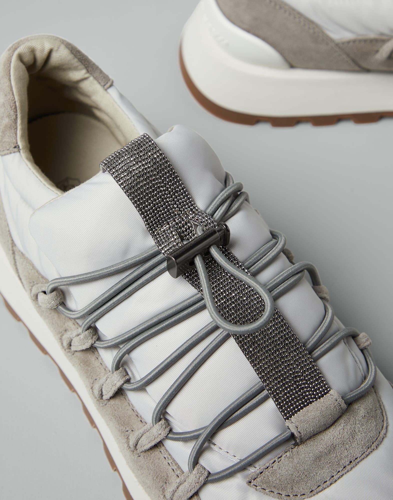 Suede and techno fabric runners with precious detail