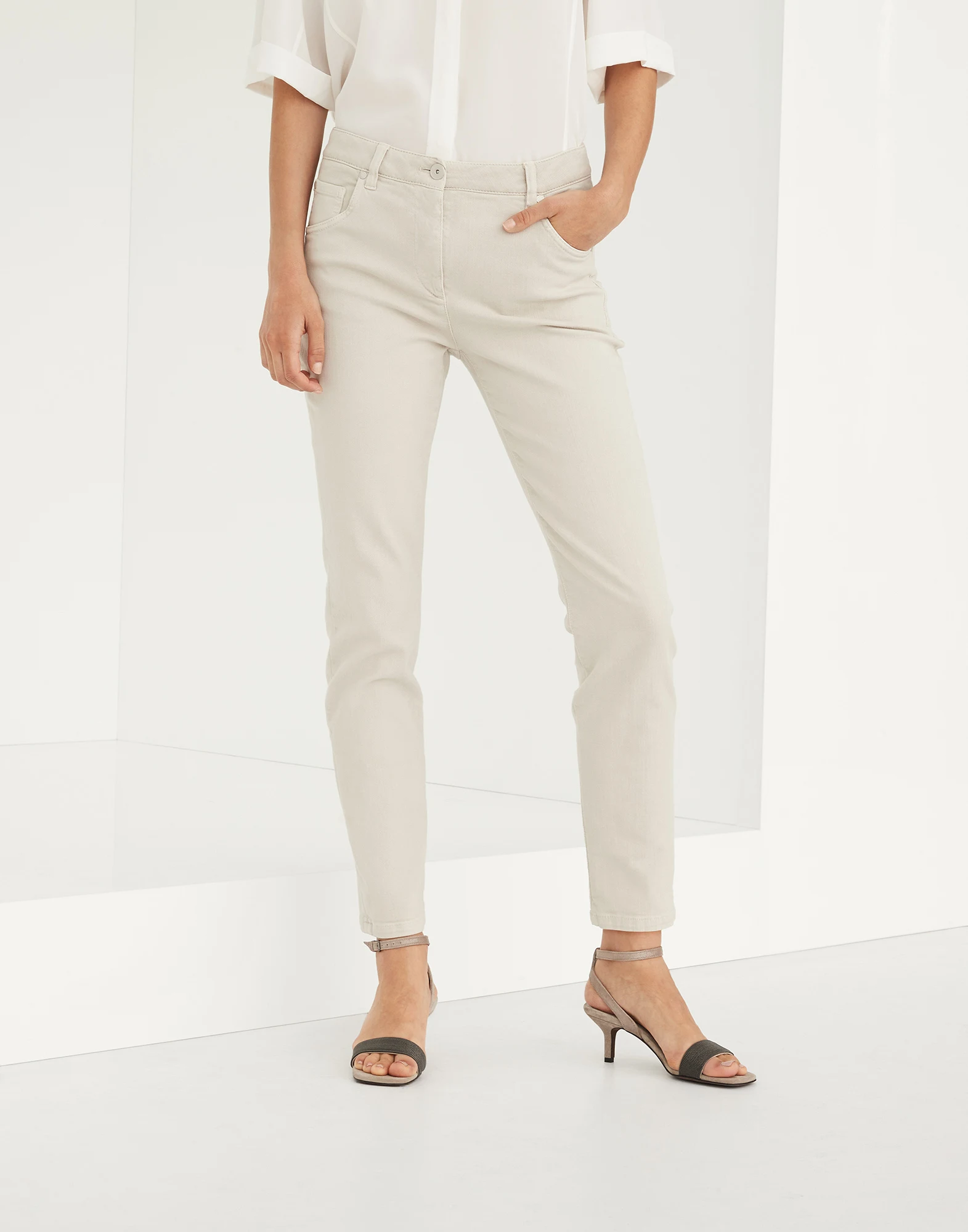 Stretch dyed denim slim trousers with shiny leather tab