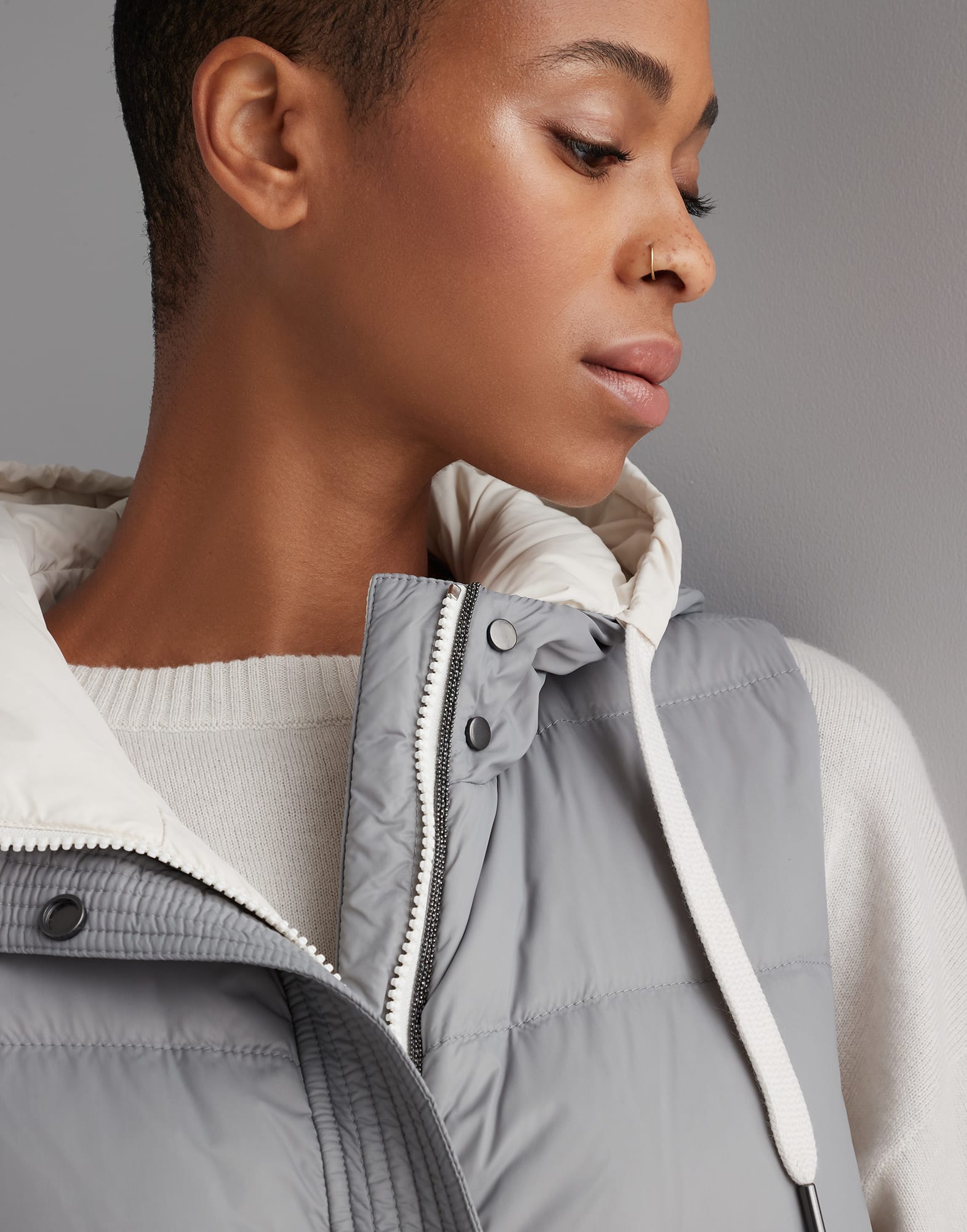 Lightweight matte nylon down vest with hood and shiny trim