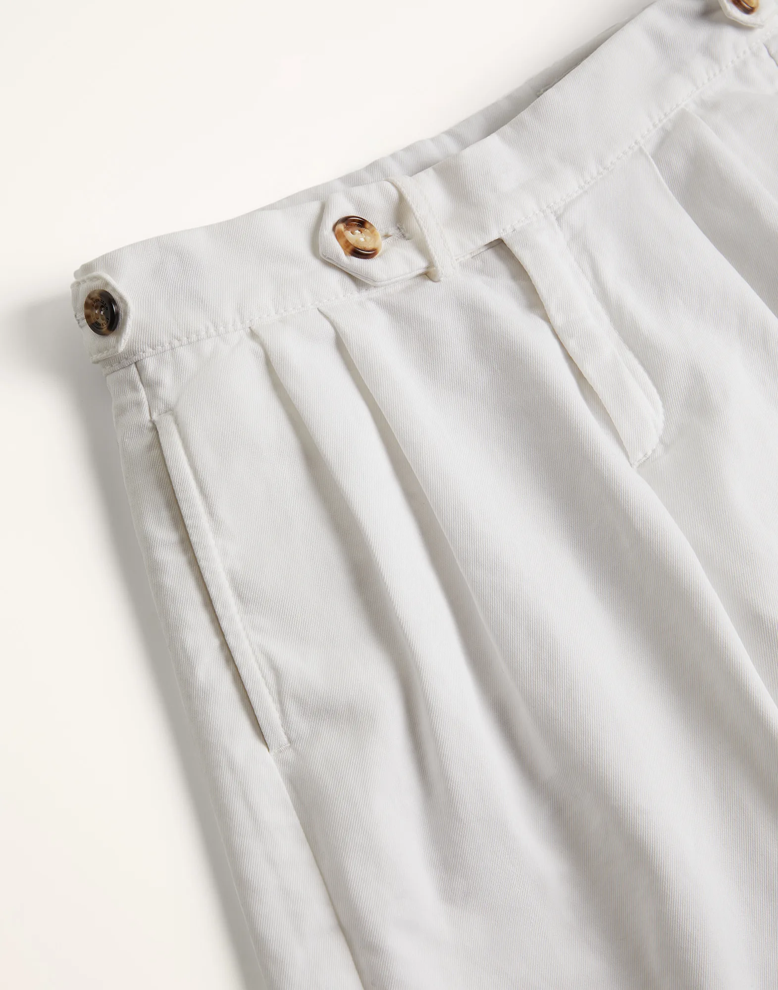 Garment-dyed Bermuda shorts in twisted cotton gabardine with pleats and waist tabs