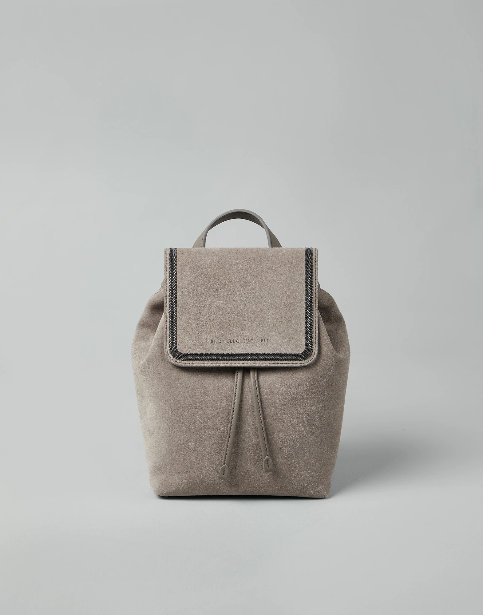 Suede backpack with precious contour