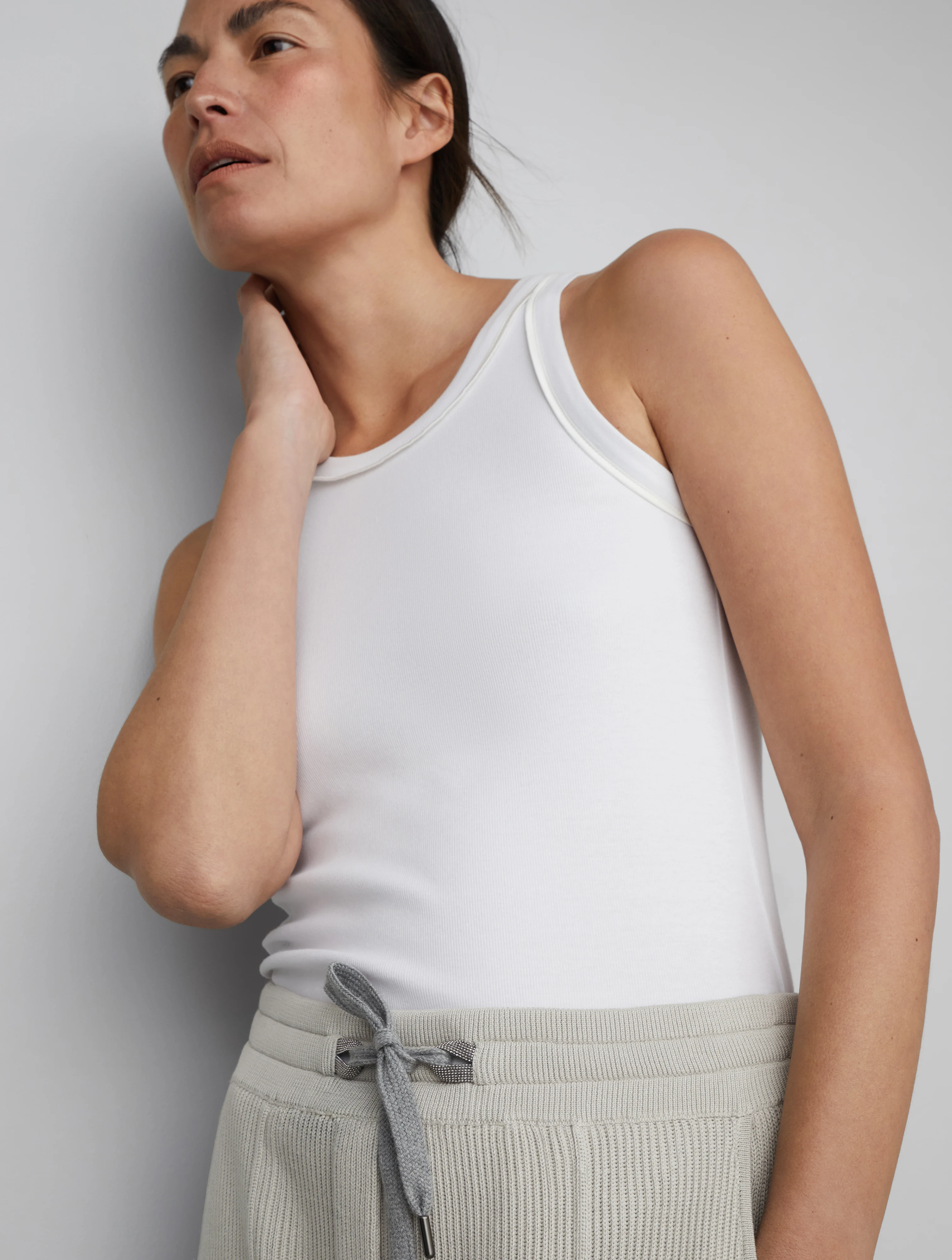 Cotton English rib knit trousers with shiny eyelets