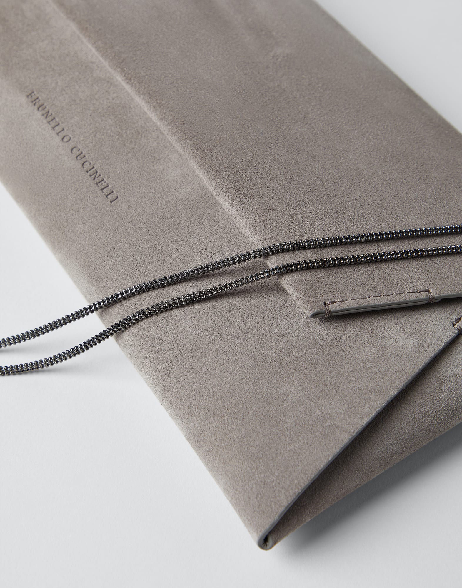Suede envelope bag with precious chain