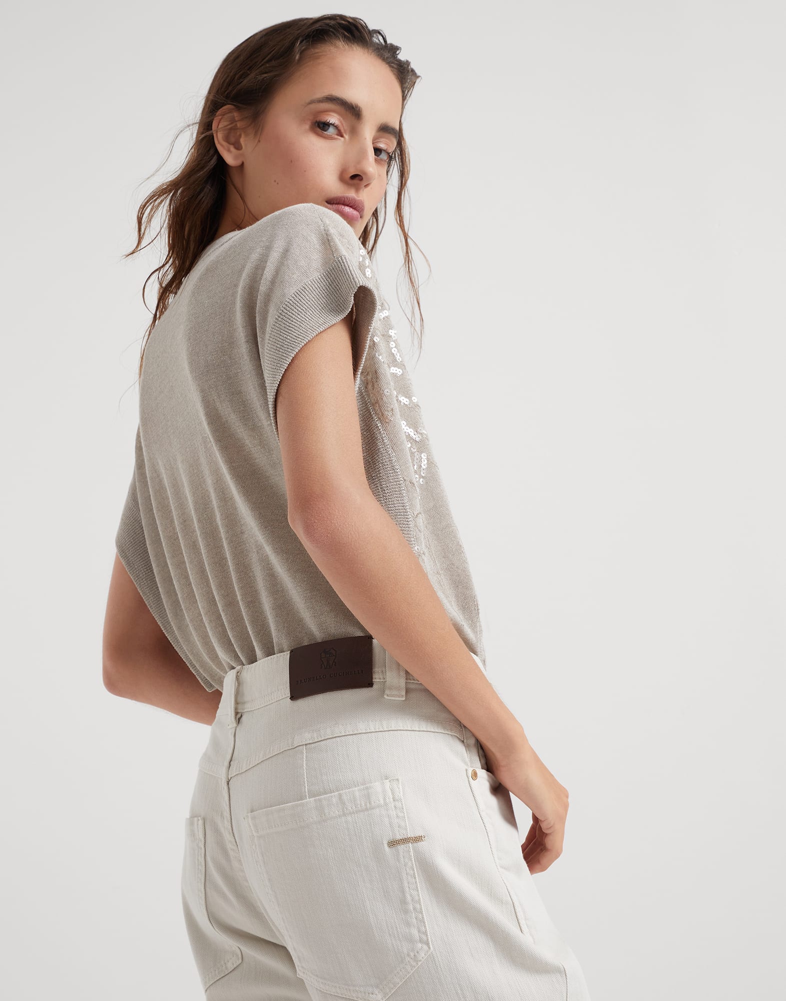 Stretch dyed denim slim tapered trousers with monili