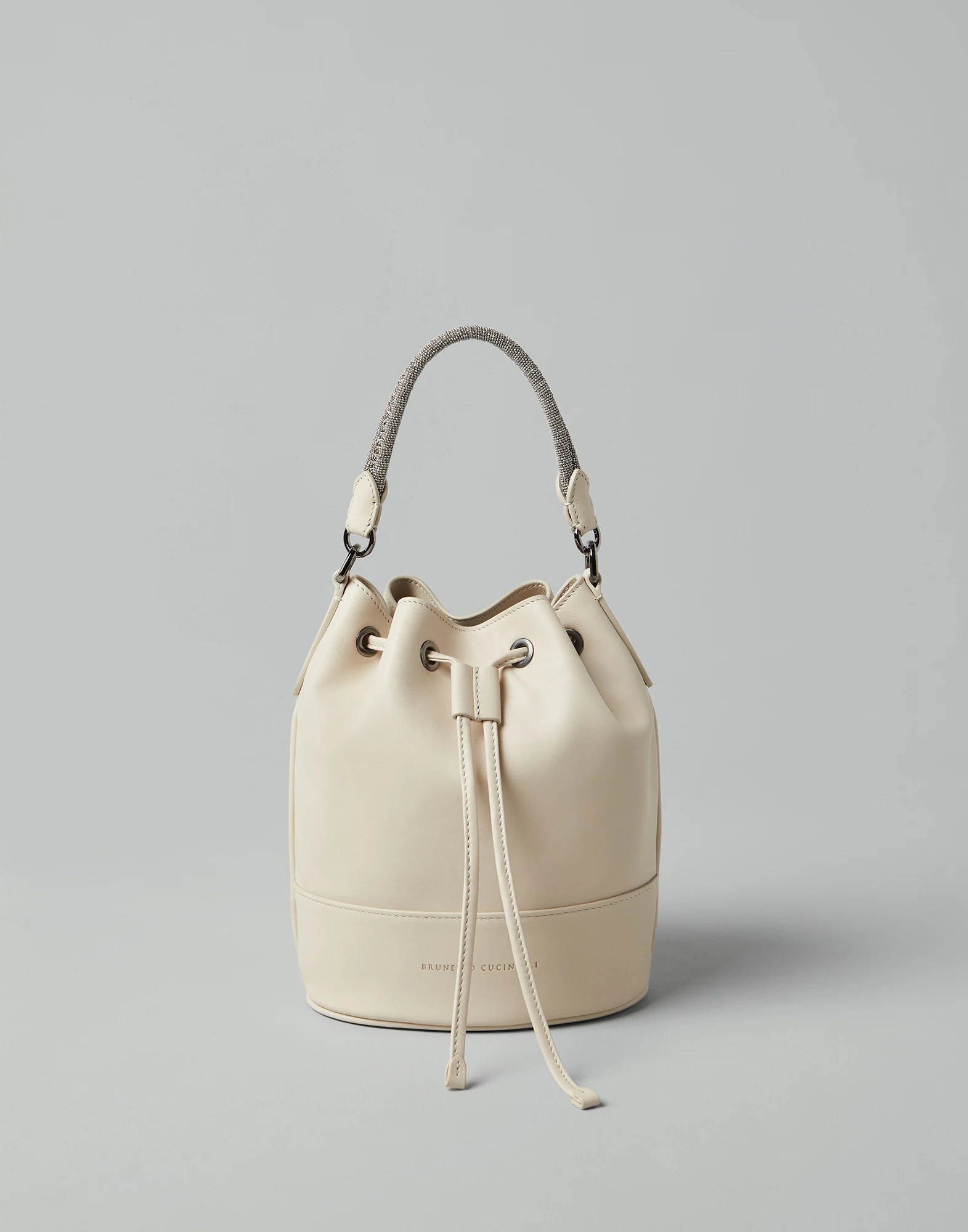 Calfskin bucket bag with precious braided handle