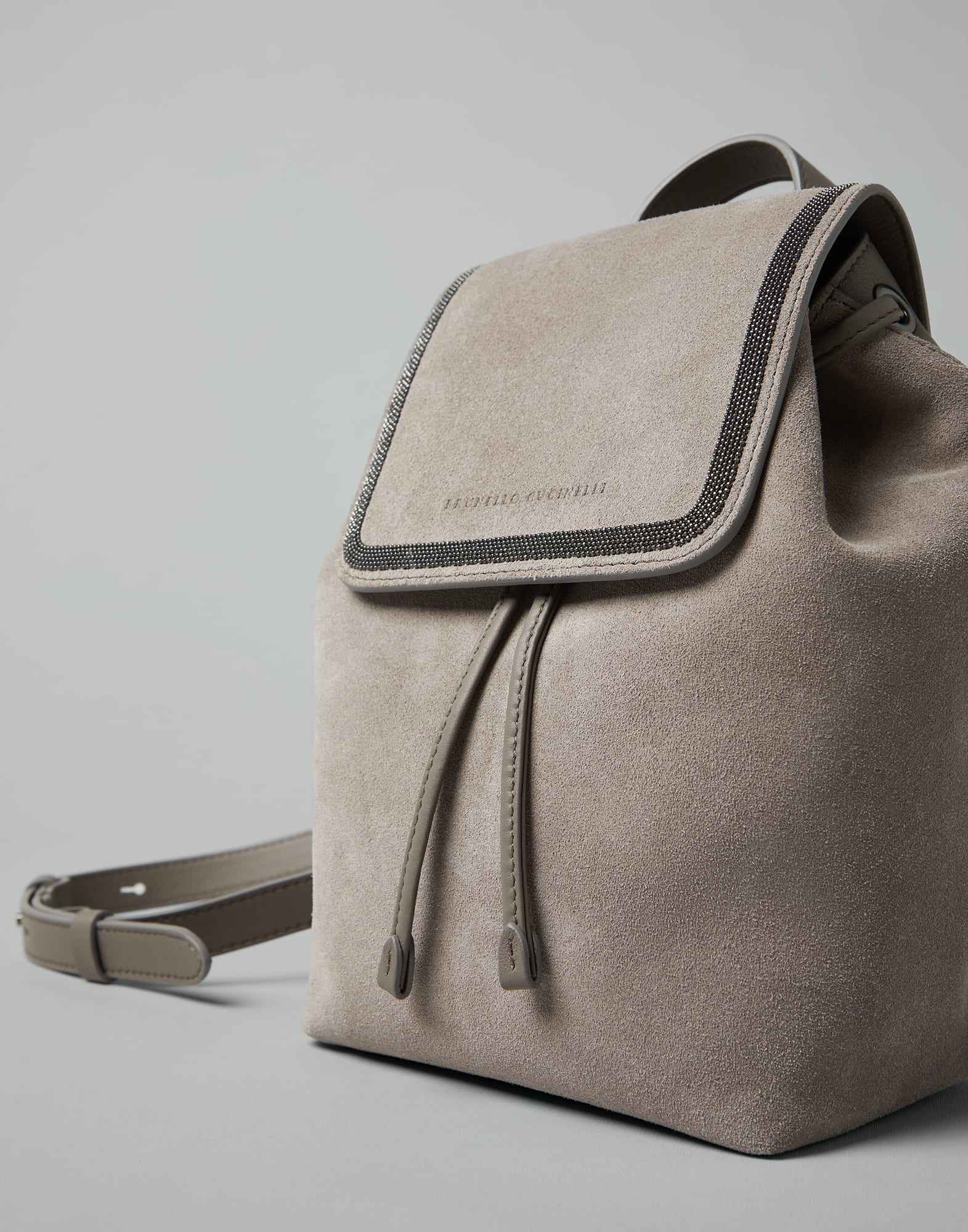 Suede backpack with precious contour