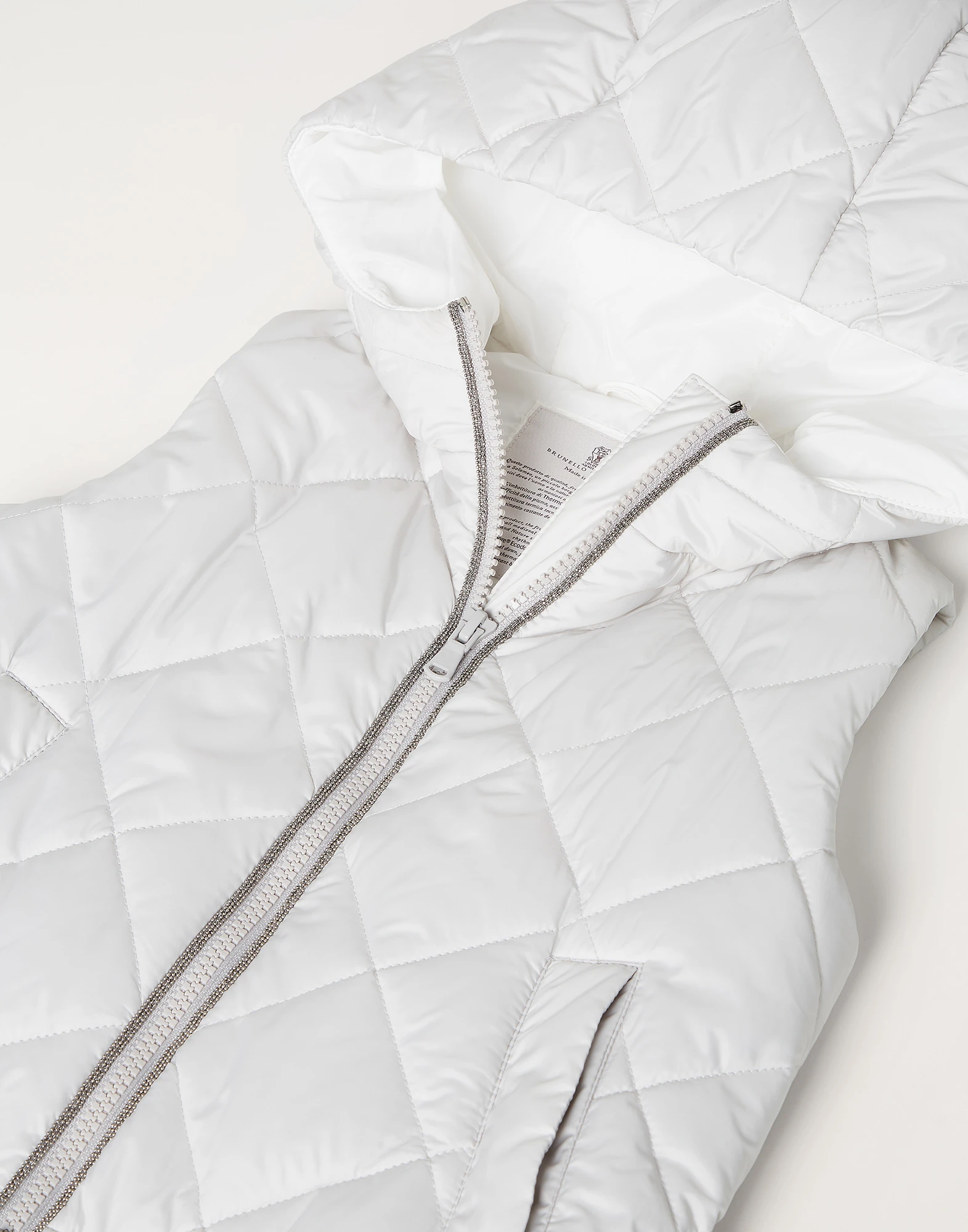 Water-resistant nylon hooded outerwear vest with Thermore? padding and monili