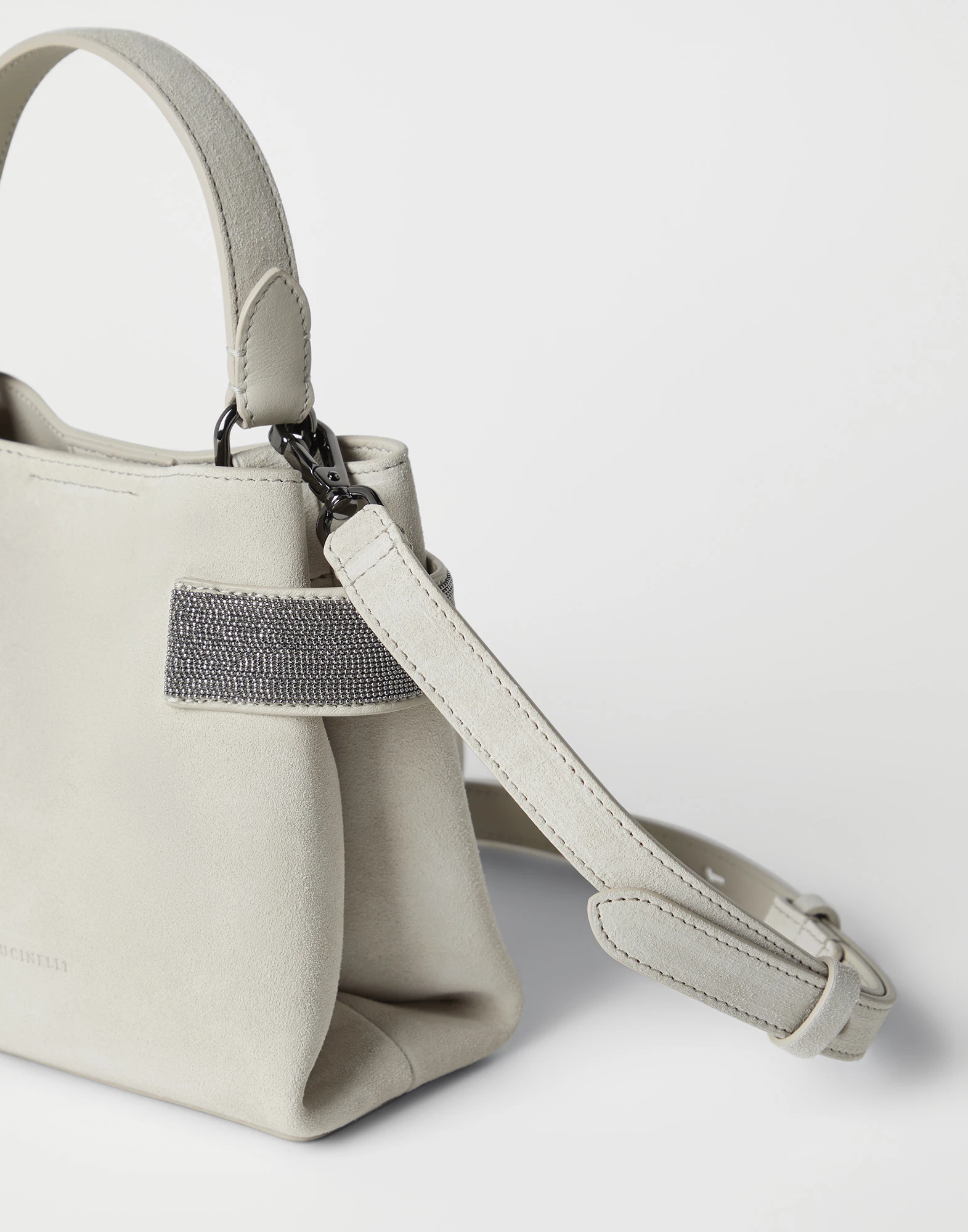 Suede bag with precious bands