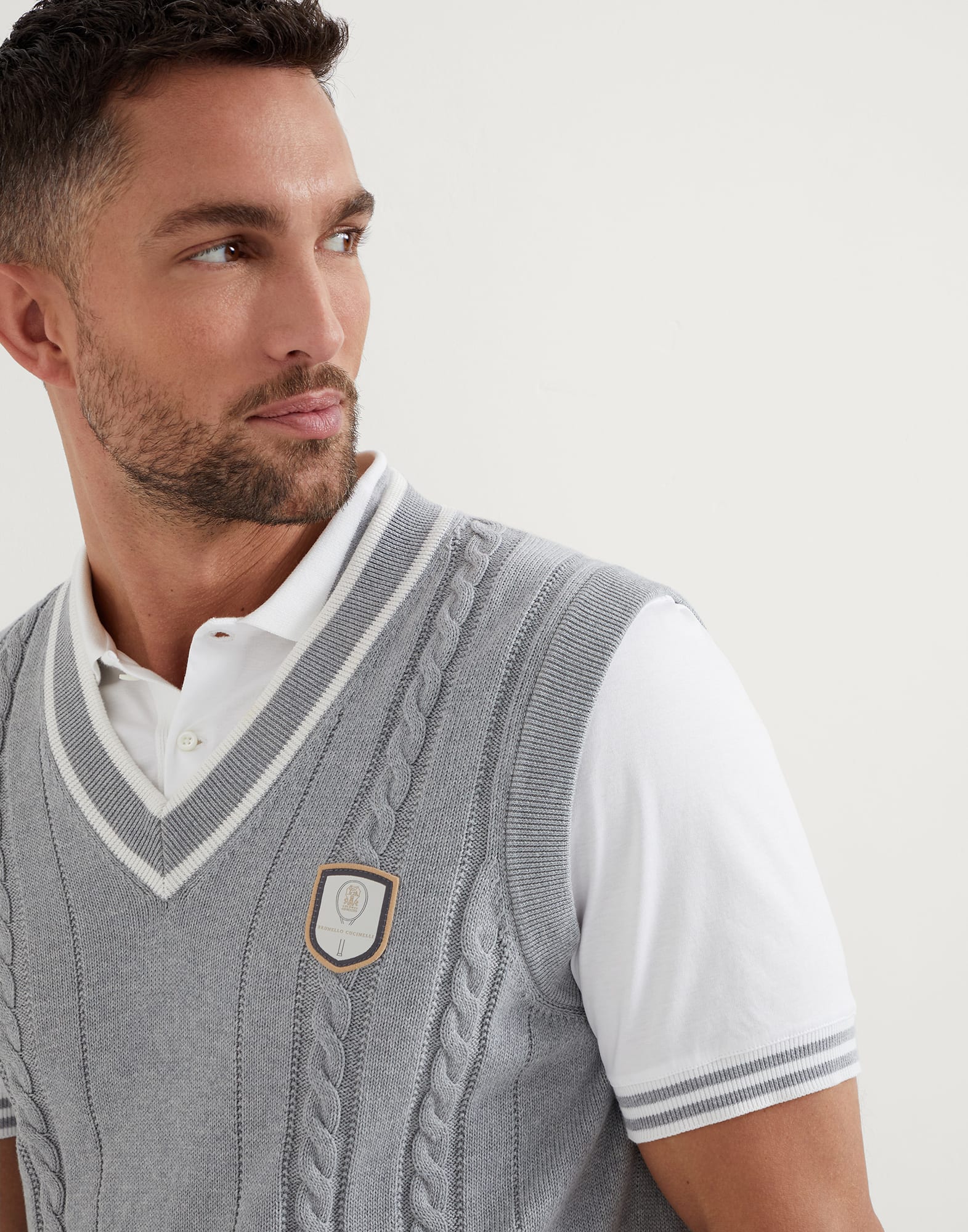 Cotton cable knit vest with tennis badge