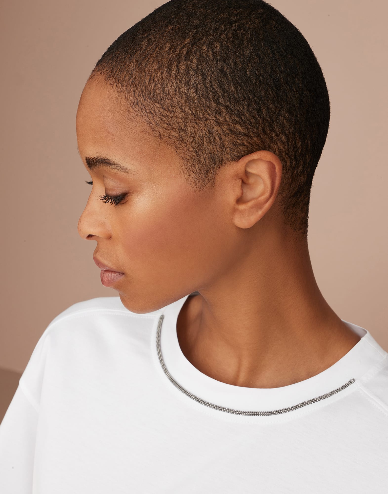 Cotton jersey T-shirt with padded shoulder and shiny neckline