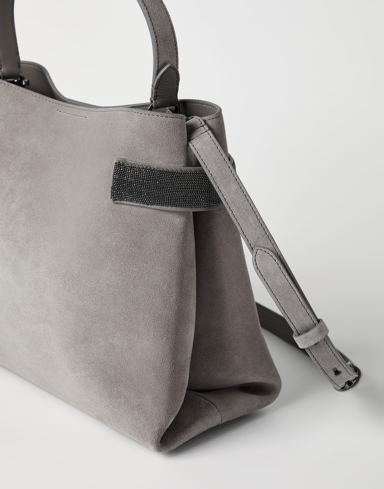 Suede bag with precious bands