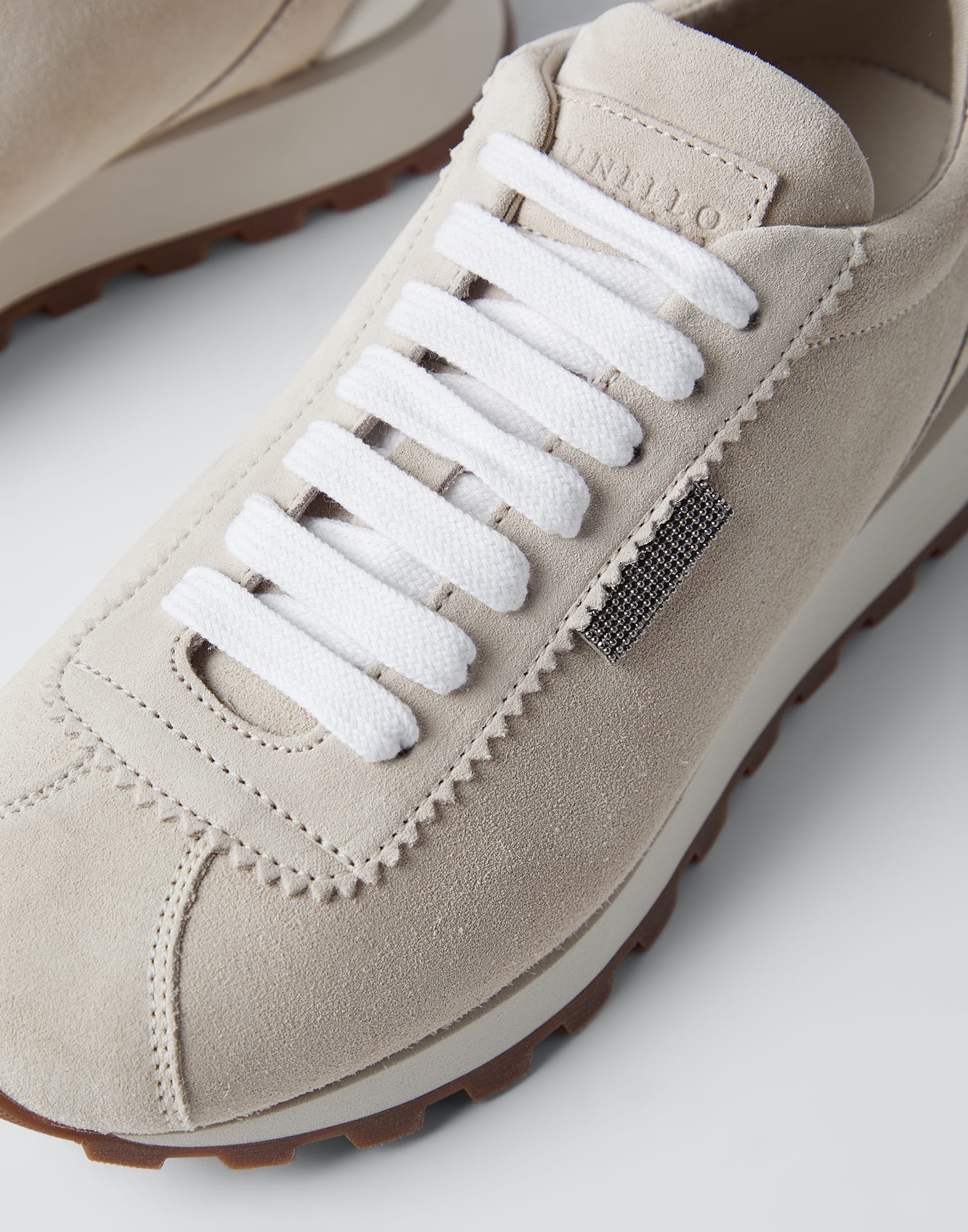 Suede runners with shiny tab
