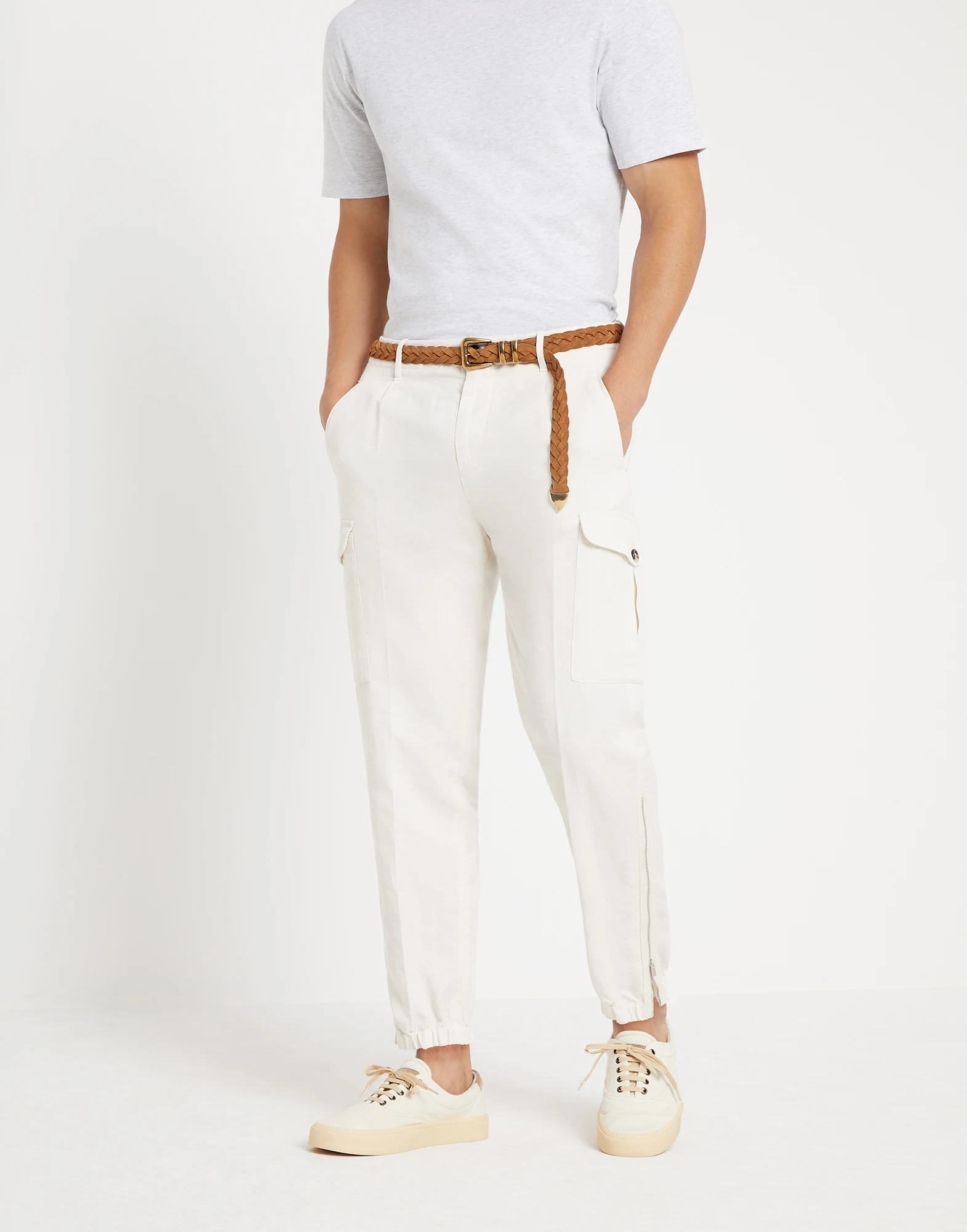 Garment-dyed ergonomic fit trousers in twisted linen and cotton gabardine with pleats, cargo pockets and zipper cuffs