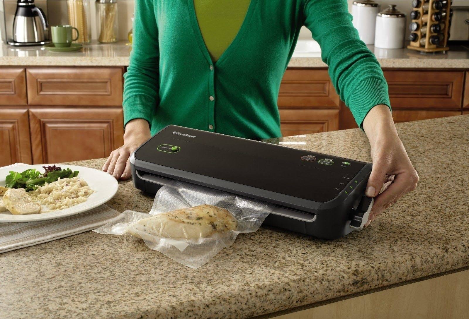 Foodsaver FM2000 Vacuum Sealer System with Starter Bags u0026 Rolls, Black