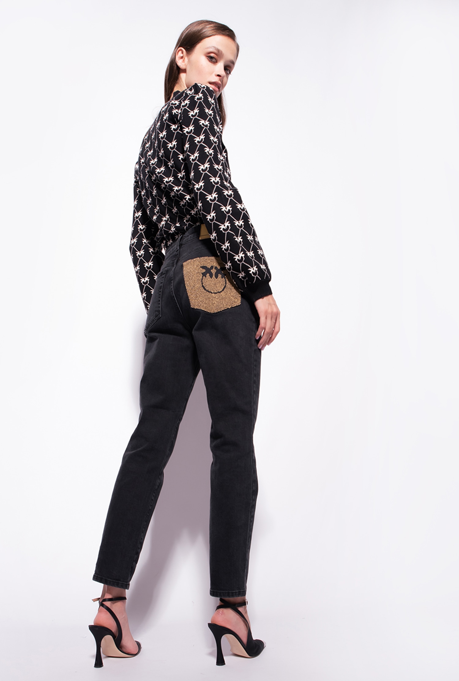 Snug-fitting black denim jeans