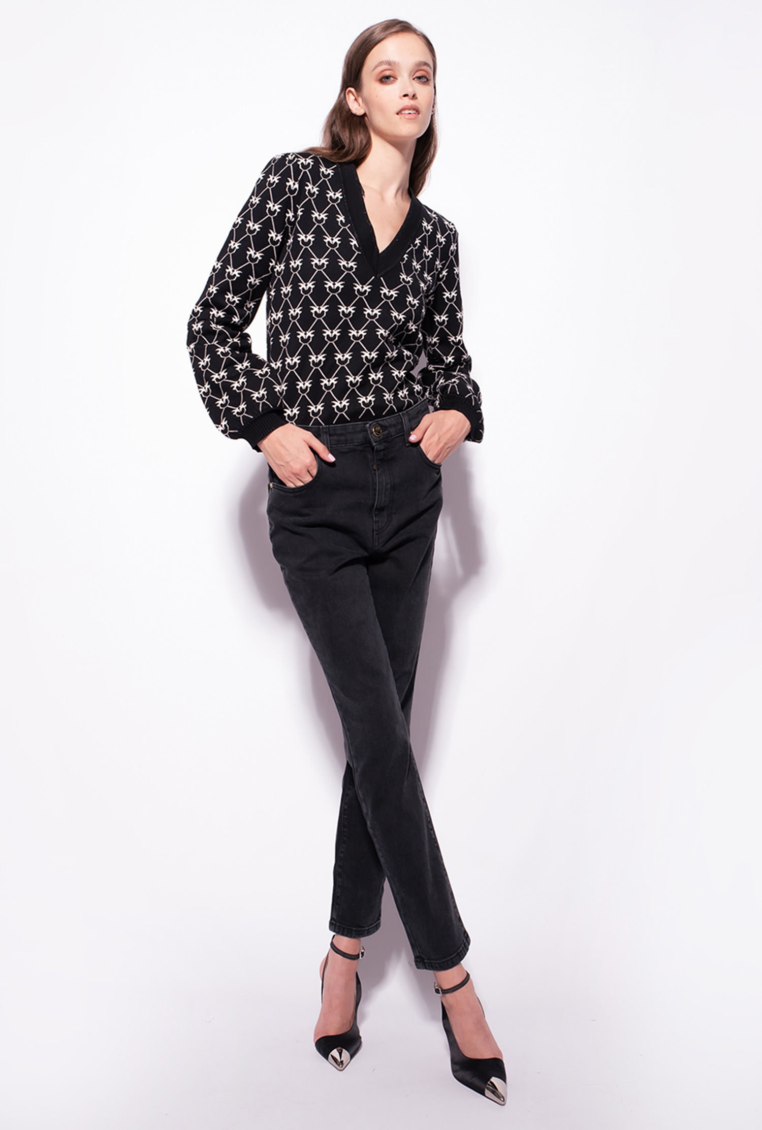 Snug-fitting black denim jeans