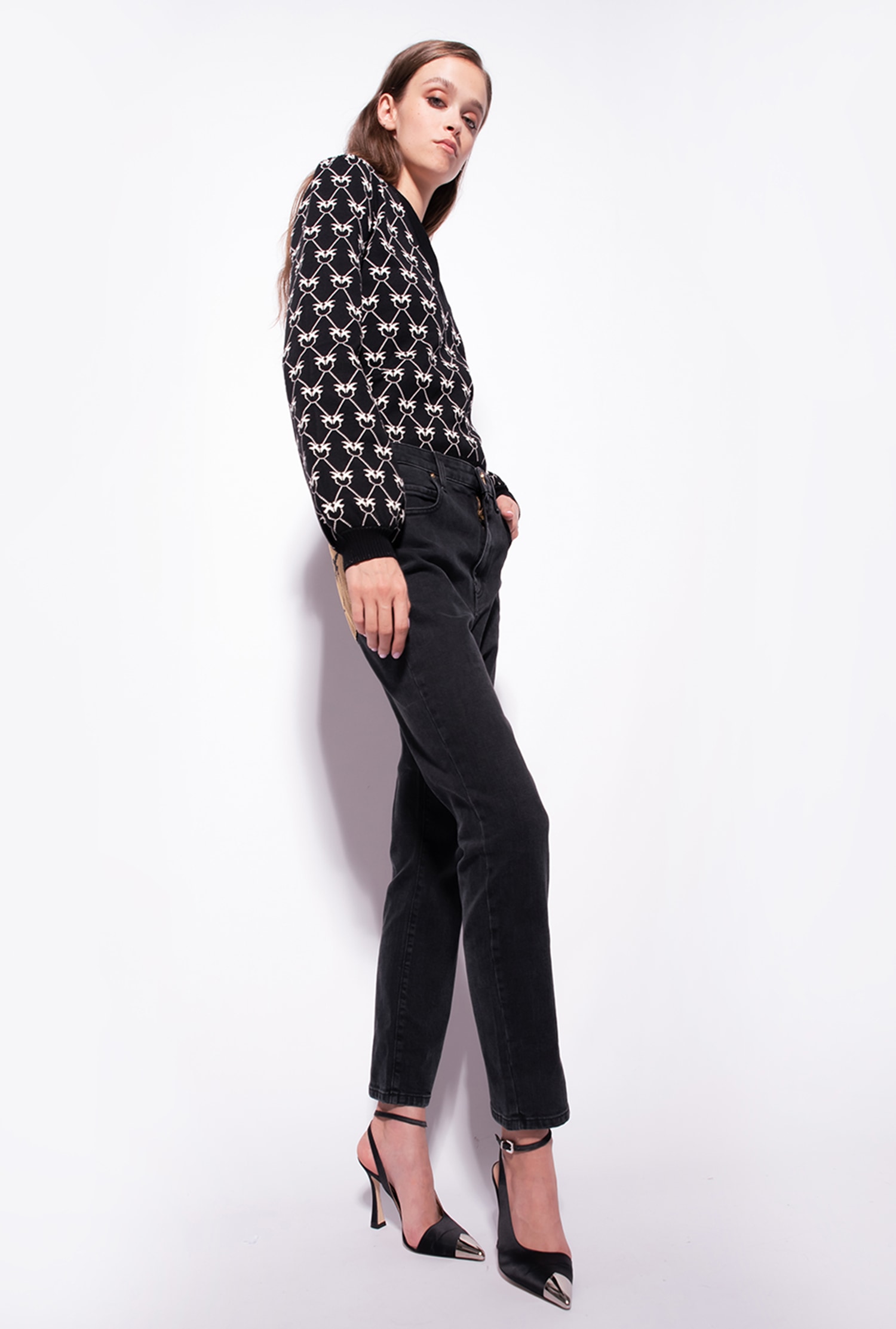 Snug-fitting black denim jeans