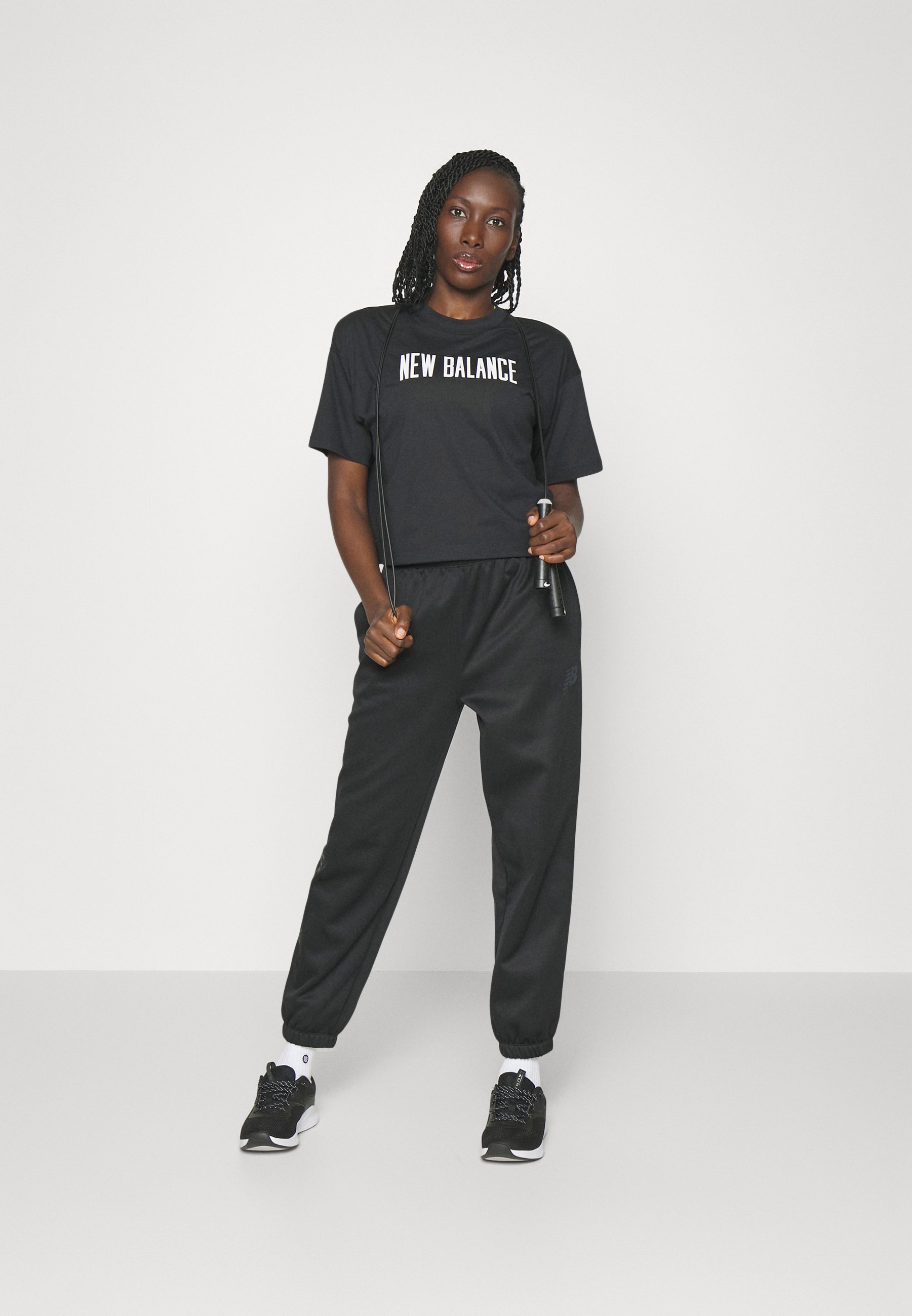 NB RELENTLESS HEATHERTECH - Print T-shirt - black (001)/black