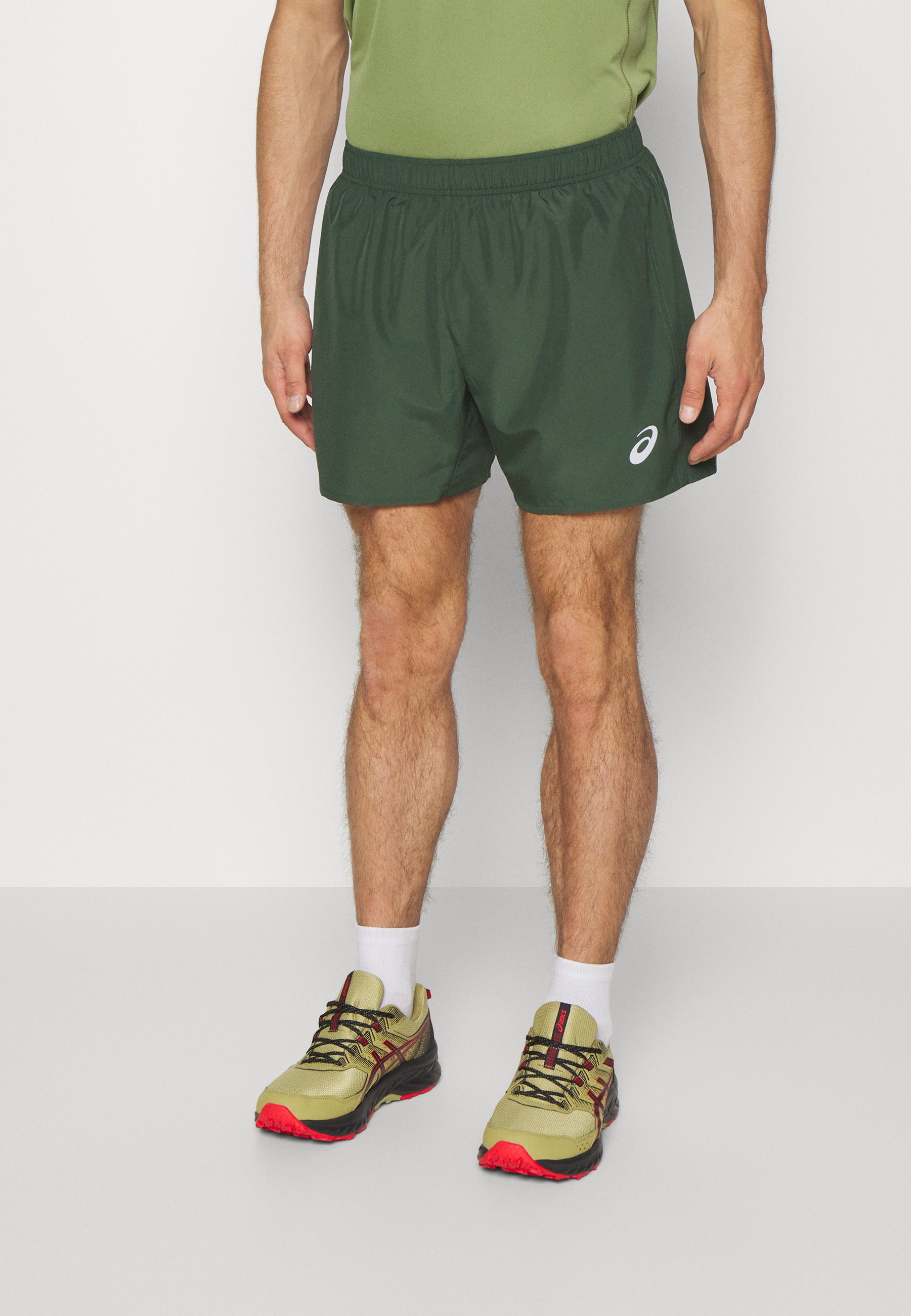 ASICS CORE - Sports shorts - rain forest/dark green