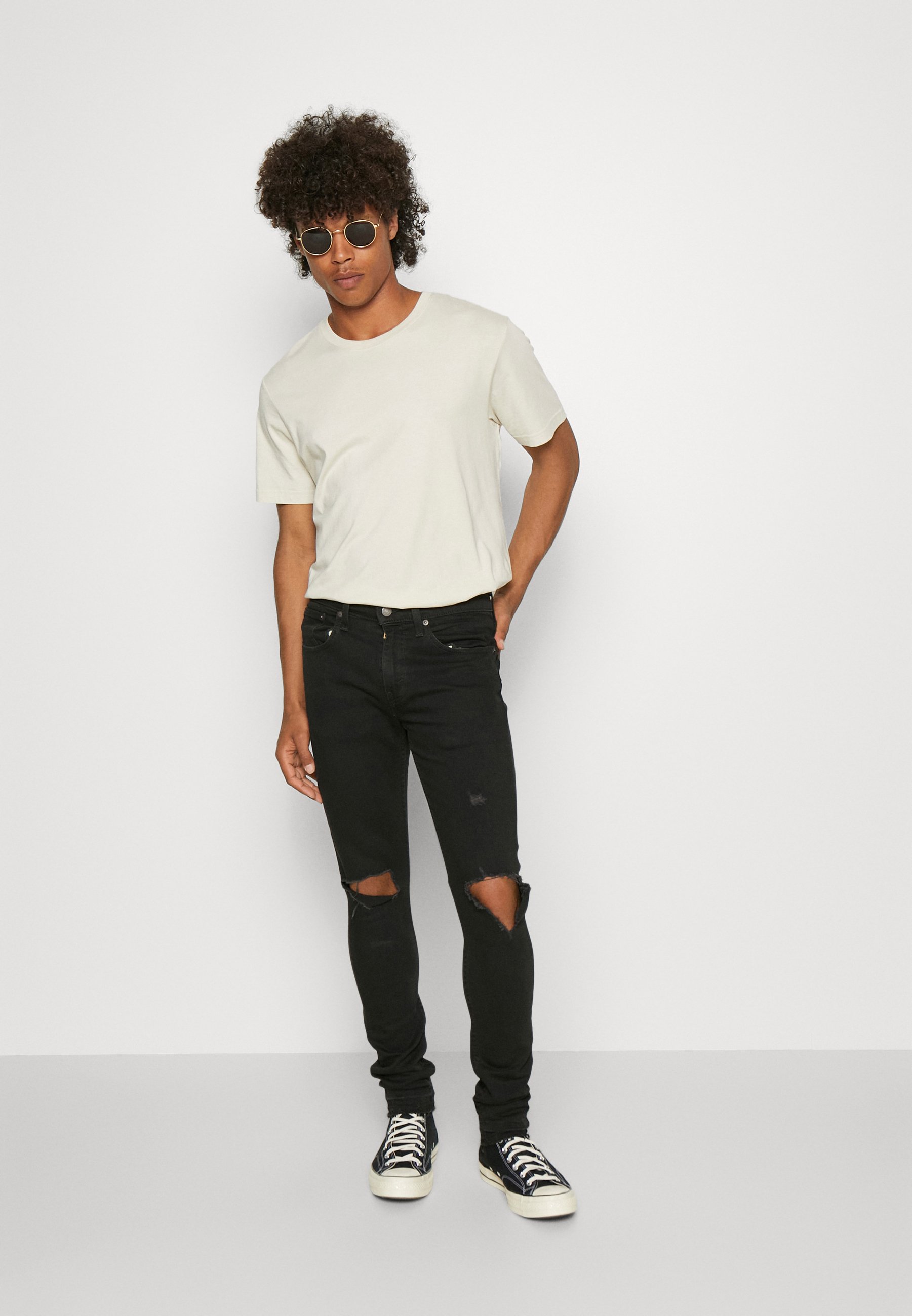 Levi's® SKINNY TAPER - Jeans Tapered Fit - black/black denim