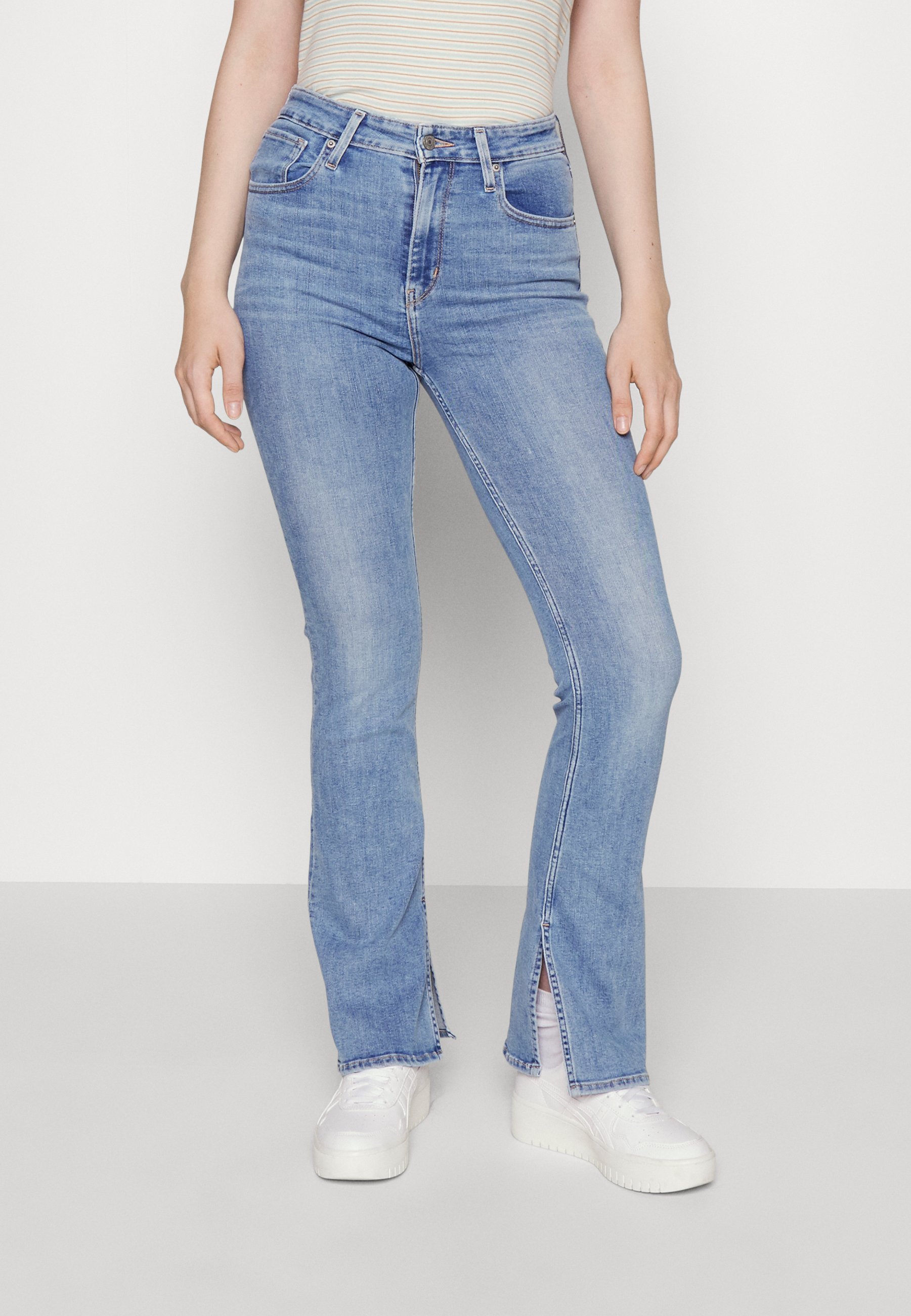 Levi's® 725™ HIGH RISE SLIT BOOTCUT - Flared Jeans - medium indigo/light-blue denim