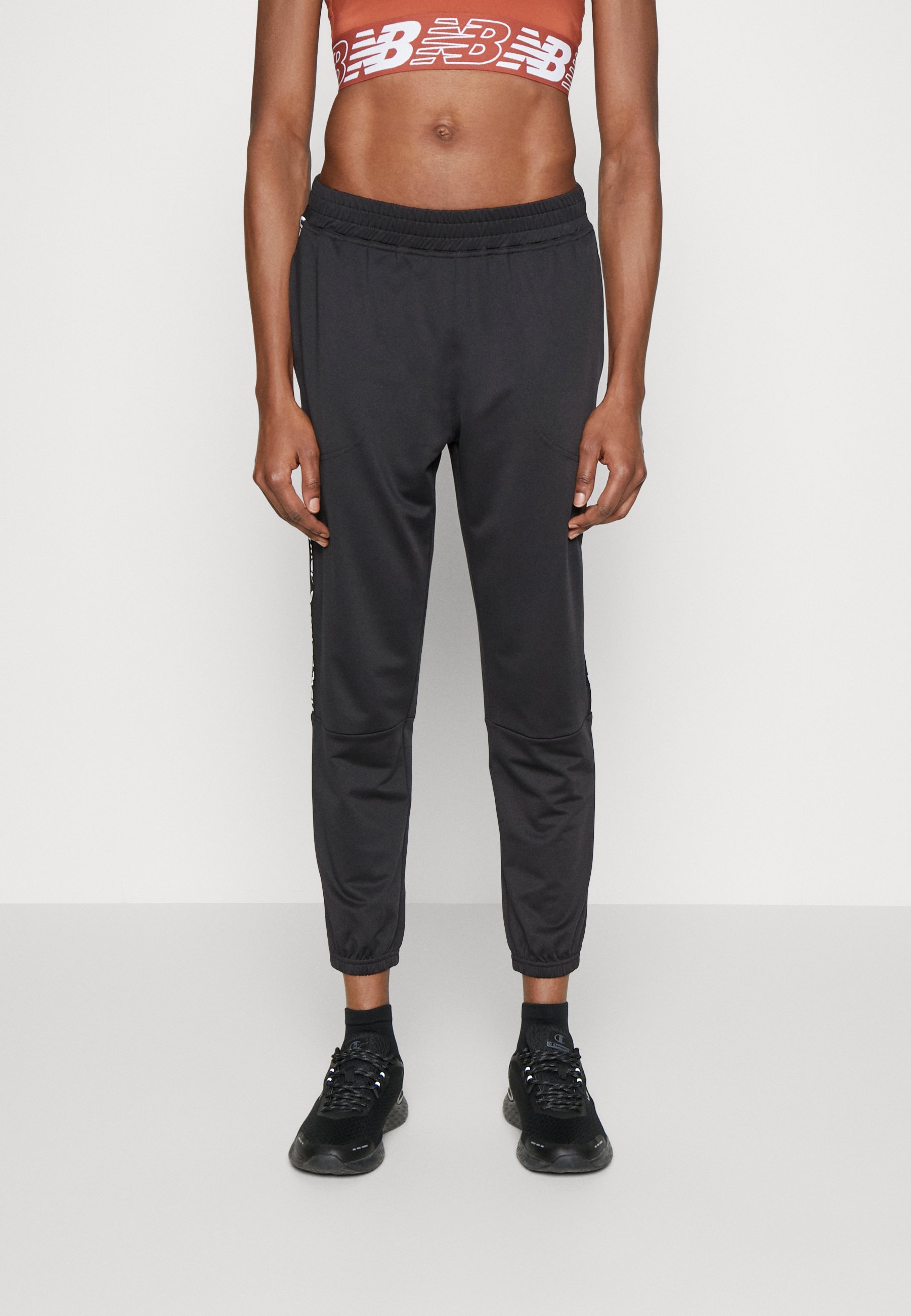 NB RELENTLESS JOGGER - Tracksuit bottoms - black