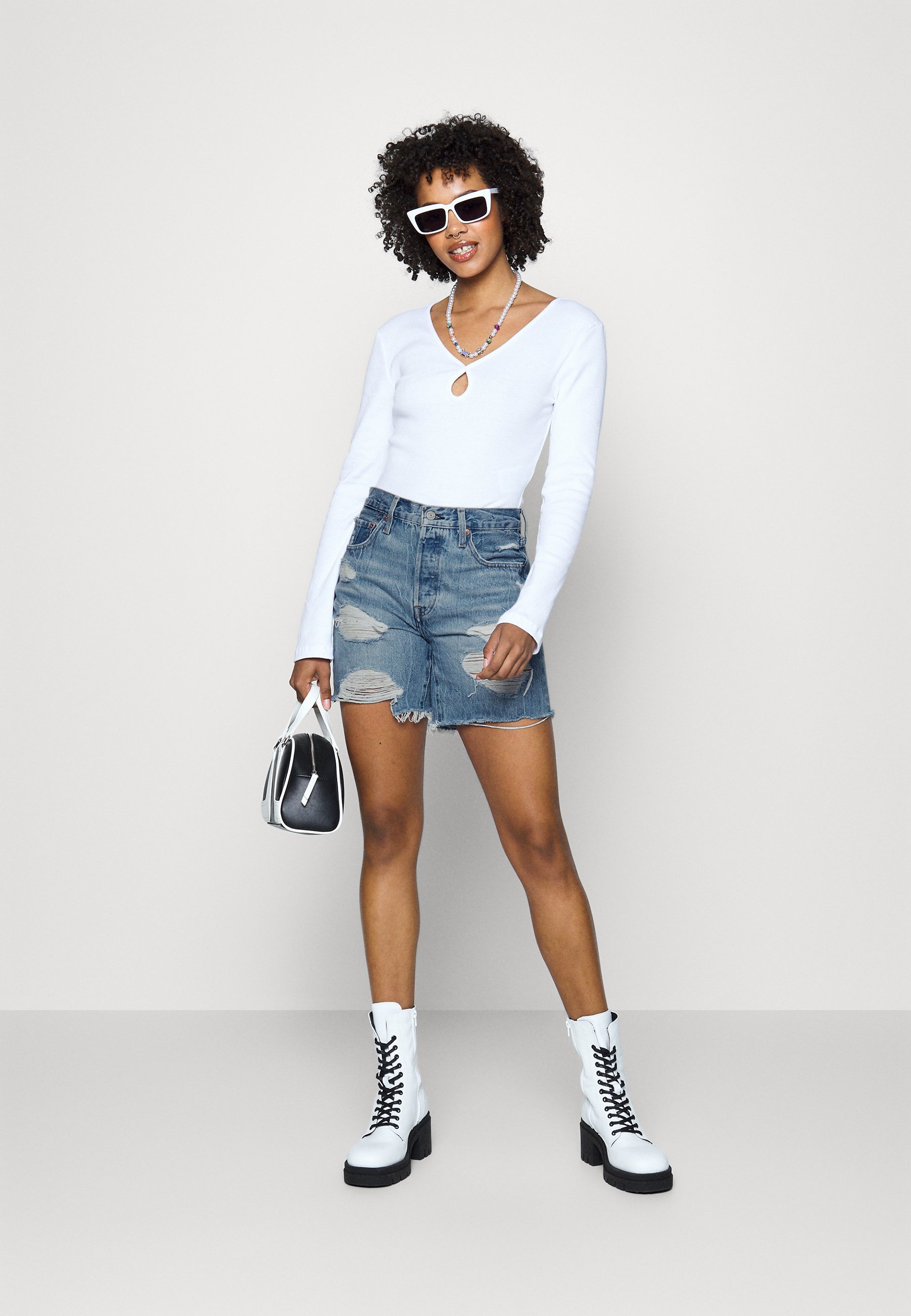 Levi's® 501® MID THIGH SHORTS - Denim shorts - z7281  light indigo/destroyed denim